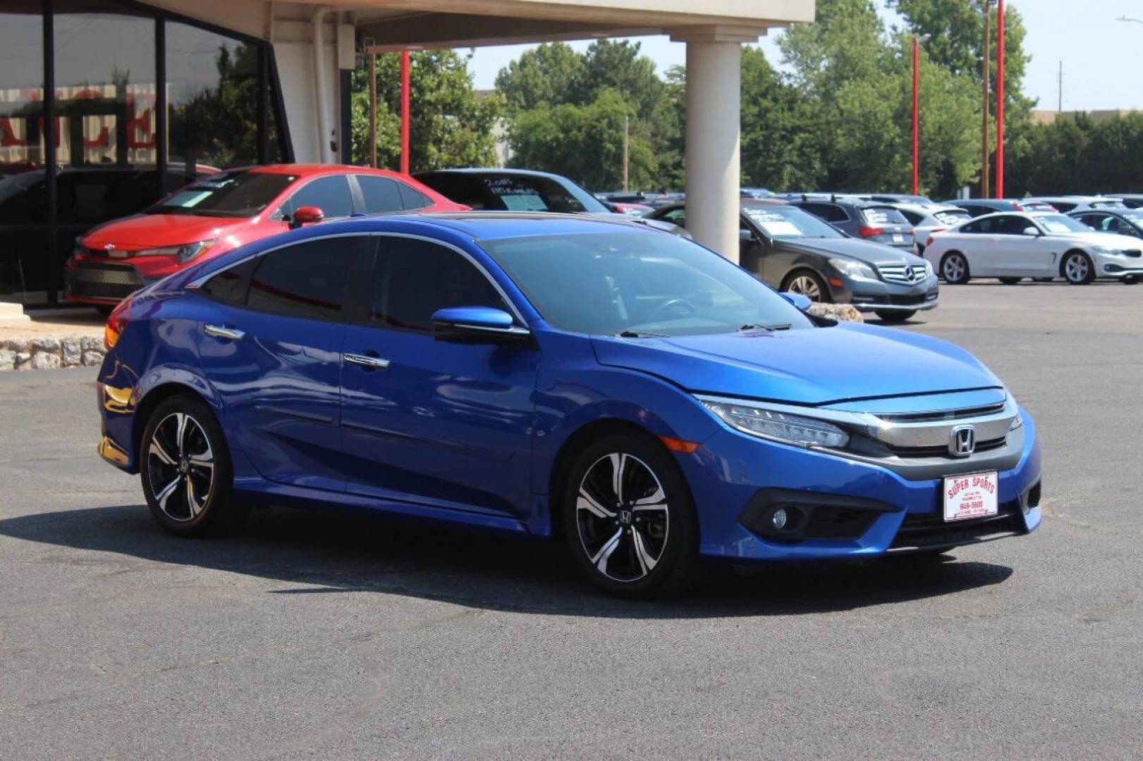 2017 Blue Honda Civic Touring Sedan CVT (19XFC1F93HE) with an 1.5L L4 DOHC 16V TURBO engine, CVT transmission, located at 4301 NW 39th , Oklahoma City, OK, 73112, (405) 949-5600, 35.512135, -97.598671 - NO DRIVERS LICENCE NO-FULL COVERAGE INSURANCE-NO CREDIT CHECK. COME ON OVER TO SUPERSPORTS AND TAKE A LOOK AND TEST DRIVE. PLEASE GIVE US A CALL AT (405) 949-5600. NO LICENSIA DE MANEJAR- NO SEGURO DE COBERTURA TOTAL- NO VERIFICACCION DE CREDITO. POR FAVOR VENGAN A SUPERSPORTS, ECHE UN - Photo#0