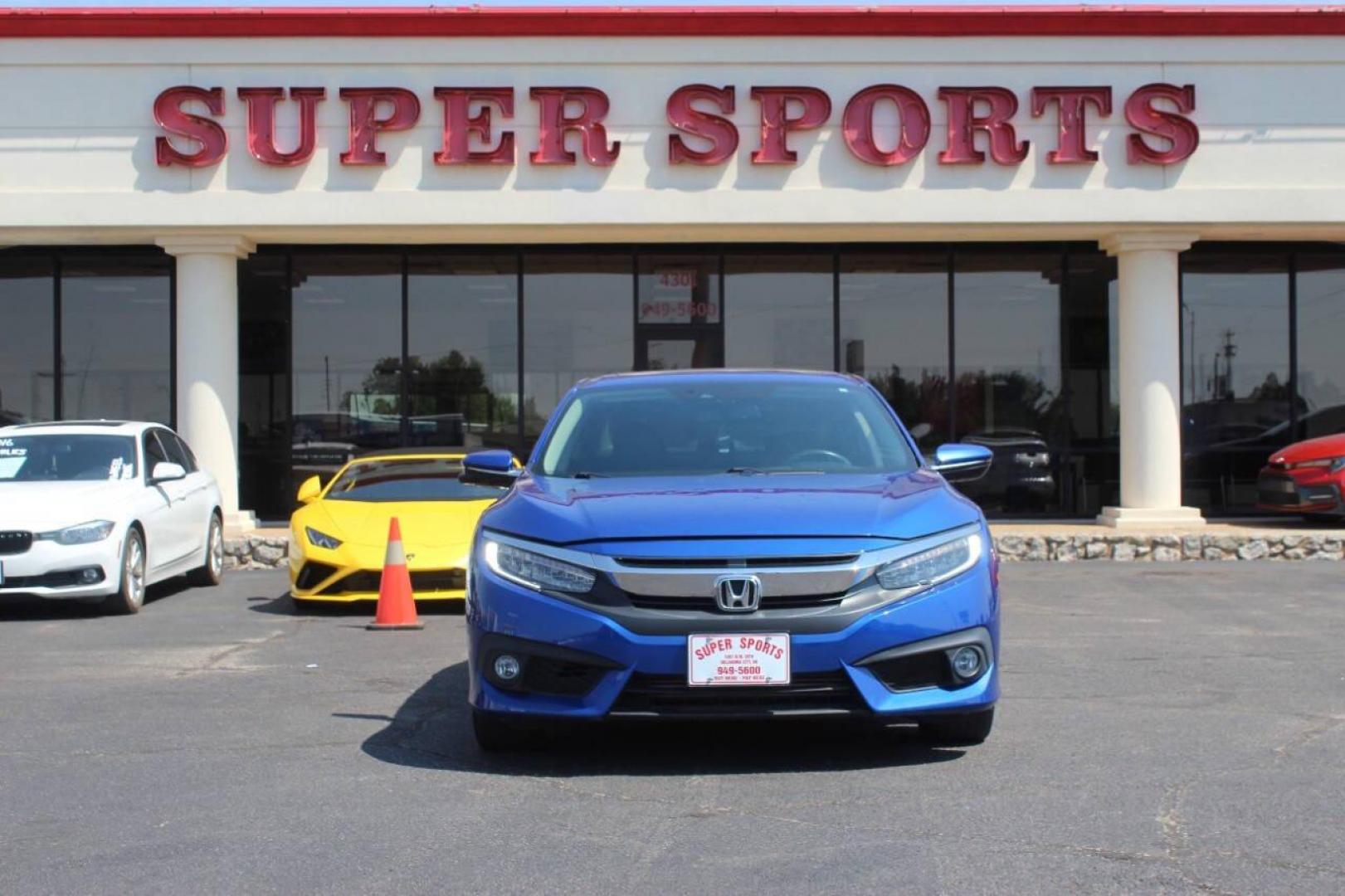 2017 Blue Honda Civic Touring Sedan CVT (19XFC1F93HE) with an 1.5L L4 DOHC 16V TURBO engine, CVT transmission, located at 4301 NW 39th , Oklahoma City, OK, 73112, (405) 949-5600, 35.512135, -97.598671 - NO DRIVERS LICENCE NO-FULL COVERAGE INSURANCE-NO CREDIT CHECK. COME ON OVER TO SUPERSPORTS AND TAKE A LOOK AND TEST DRIVE. PLEASE GIVE US A CALL AT (405) 949-5600. NO LICENSIA DE MANEJAR- NO SEGURO DE COBERTURA TOTAL- NO VERIFICACCION DE CREDITO. POR FAVOR VENGAN A SUPERSPORTS, ECHE UN - Photo#2