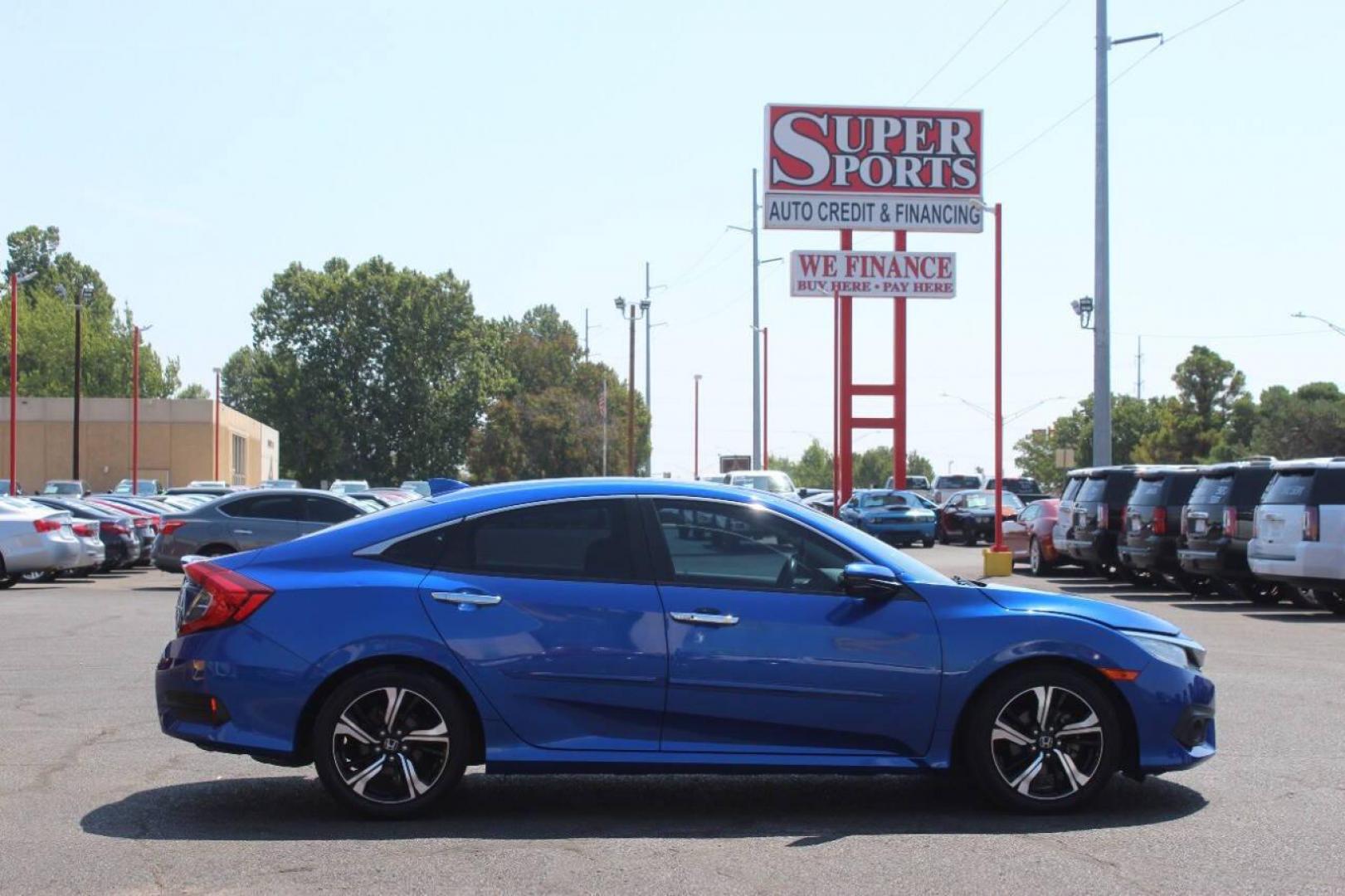 2017 Blue Honda Civic Touring Sedan CVT (19XFC1F93HE) with an 1.5L L4 DOHC 16V TURBO engine, CVT transmission, located at 4301 NW 39th , Oklahoma City, OK, 73112, (405) 949-5600, 35.512135, -97.598671 - NO DRIVERS LICENCE NO-FULL COVERAGE INSURANCE-NO CREDIT CHECK. COME ON OVER TO SUPERSPORTS AND TAKE A LOOK AND TEST DRIVE. PLEASE GIVE US A CALL AT (405) 949-5600. NO LICENSIA DE MANEJAR- NO SEGURO DE COBERTURA TOTAL- NO VERIFICACCION DE CREDITO. POR FAVOR VENGAN A SUPERSPORTS, ECHE UN - Photo#3