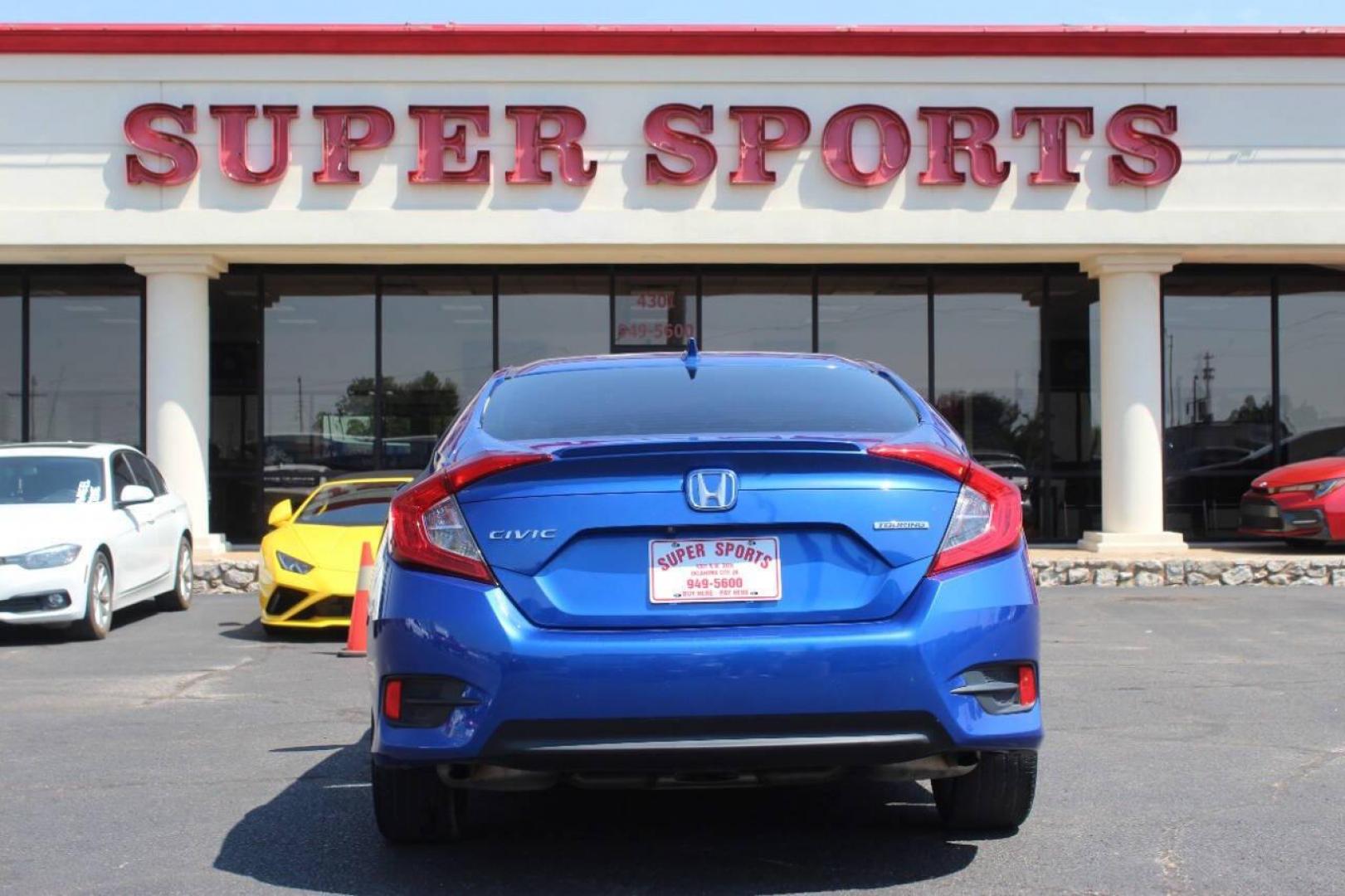 2017 Blue Honda Civic Touring Sedan CVT (19XFC1F93HE) with an 1.5L L4 DOHC 16V TURBO engine, CVT transmission, located at 4301 NW 39th , Oklahoma City, OK, 73112, (405) 949-5600, 35.512135, -97.598671 - NO DRIVERS LICENCE NO-FULL COVERAGE INSURANCE-NO CREDIT CHECK. COME ON OVER TO SUPERSPORTS AND TAKE A LOOK AND TEST DRIVE. PLEASE GIVE US A CALL AT (405) 949-5600. NO LICENSIA DE MANEJAR- NO SEGURO DE COBERTURA TOTAL- NO VERIFICACCION DE CREDITO. POR FAVOR VENGAN A SUPERSPORTS, ECHE UN - Photo#4