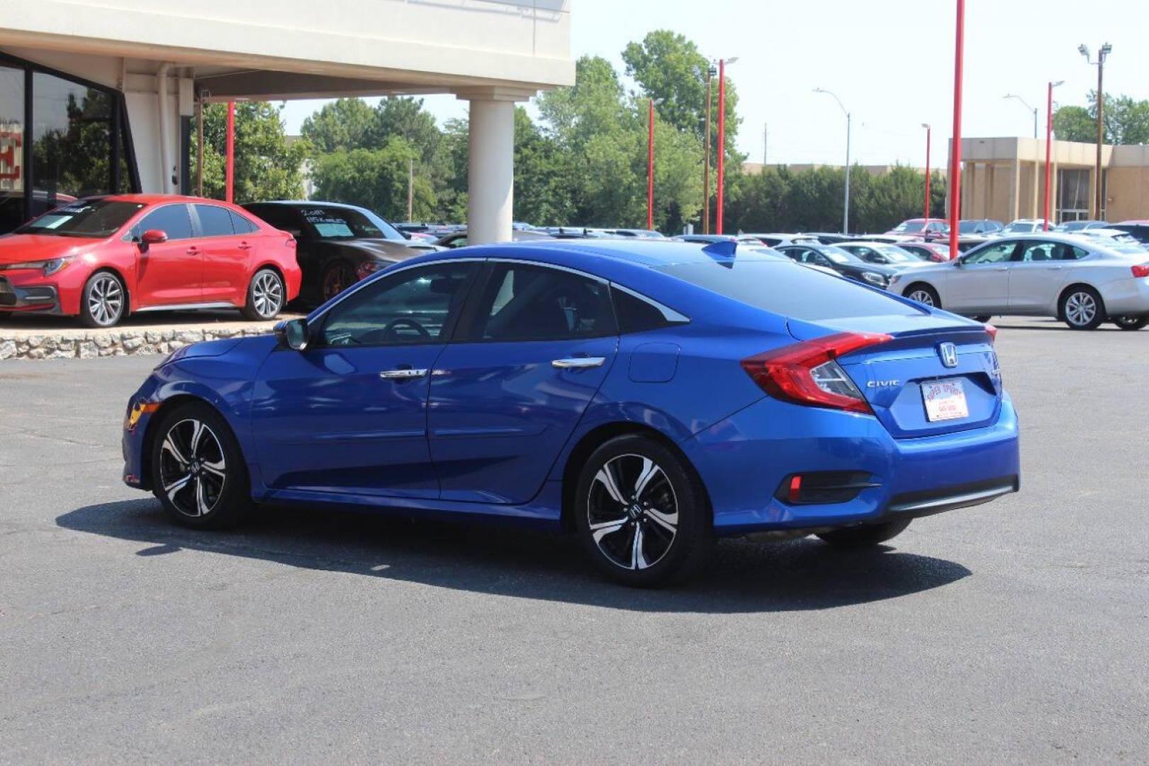 2017 Blue Honda Civic Touring Sedan CVT (19XFC1F93HE) with an 1.5L L4 DOHC 16V TURBO engine, CVT transmission, located at 4301 NW 39th , Oklahoma City, OK, 73112, (405) 949-5600, 35.512135, -97.598671 - NO DRIVERS LICENCE NO-FULL COVERAGE INSURANCE-NO CREDIT CHECK. COME ON OVER TO SUPERSPORTS AND TAKE A LOOK AND TEST DRIVE. PLEASE GIVE US A CALL AT (405) 949-5600. NO LICENSIA DE MANEJAR- NO SEGURO DE COBERTURA TOTAL- NO VERIFICACCION DE CREDITO. POR FAVOR VENGAN A SUPERSPORTS, ECHE UN - Photo#5