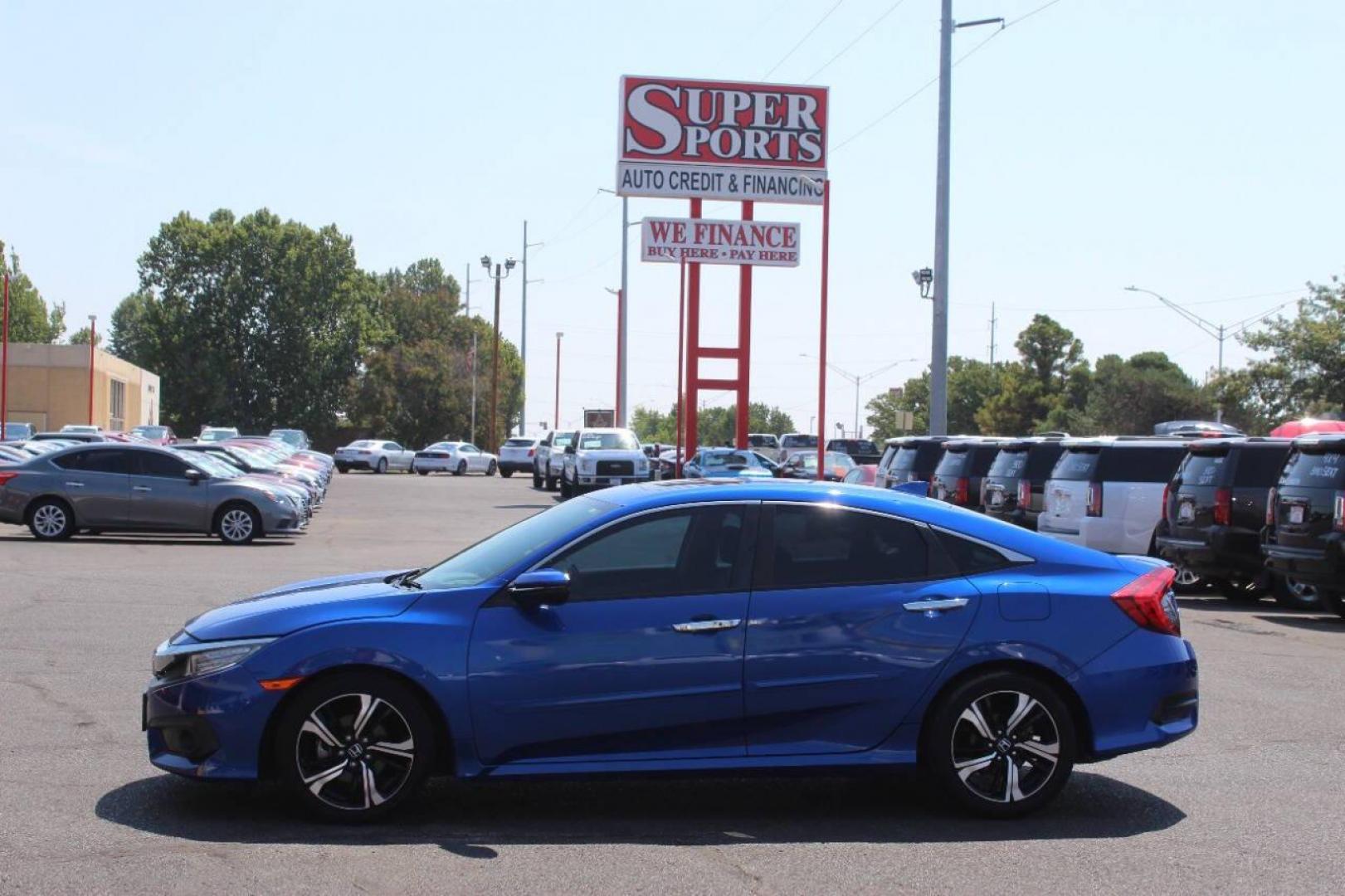 2017 Blue Honda Civic Touring Sedan CVT (19XFC1F93HE) with an 1.5L L4 DOHC 16V TURBO engine, CVT transmission, located at 4301 NW 39th , Oklahoma City, OK, 73112, (405) 949-5600, 35.512135, -97.598671 - NO DRIVERS LICENCE NO-FULL COVERAGE INSURANCE-NO CREDIT CHECK. COME ON OVER TO SUPERSPORTS AND TAKE A LOOK AND TEST DRIVE. PLEASE GIVE US A CALL AT (405) 949-5600. NO LICENSIA DE MANEJAR- NO SEGURO DE COBERTURA TOTAL- NO VERIFICACCION DE CREDITO. POR FAVOR VENGAN A SUPERSPORTS, ECHE UN - Photo#6