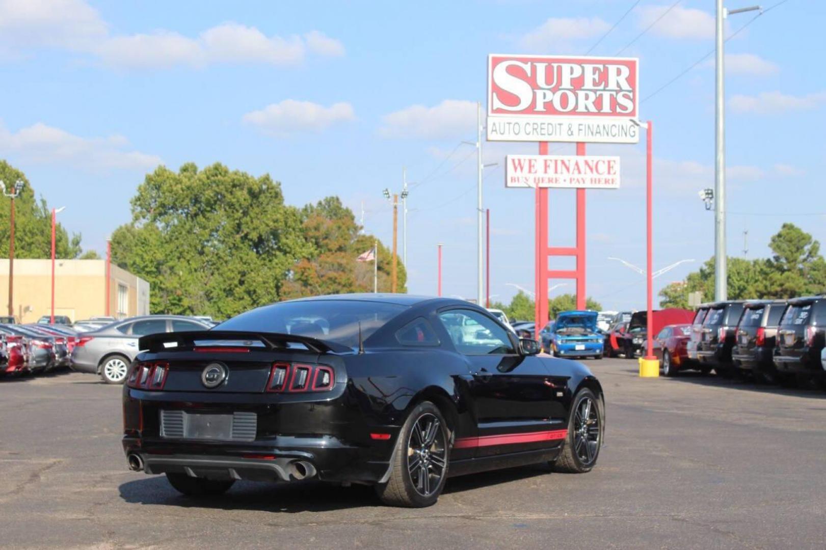 2013 Black Ford Mustang GT Coupe (1ZVBP8CF1D5) with an 5.0L V8 DOHC 32V engine, Manual 6-Speed transmission, located at 4301 NW 39th , Oklahoma City, OK, 73112, (405) 949-5600, 35.512135, -97.598671 - NO DRIVERS LICENCE NO-FULL COVERAGE INSURANCE-NO CREDIT CHECK. COME ON OVER TO SUPERSPORTS AND TAKE A LOOK AND TEST DRIVE. PLEASE GIVE US A CALL AT (405) 949-5600. NO LICENSIA DE MANEJAR- NO SEGURO DE COBERTURA TOTAL- NO VERIFICACCION DE CREDITO. POR FAVOR VENGAN A SUPERSPORTS, ECHE UN - Photo#3