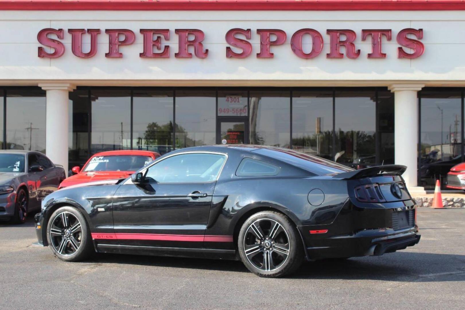 2013 Black Ford Mustang GT Coupe (1ZVBP8CF1D5) with an 5.0L V8 DOHC 32V engine, Manual 6-Speed transmission, located at 4301 NW 39th , Oklahoma City, OK, 73112, (405) 949-5600, 35.512135, -97.598671 - NO DRIVERS LICENCE NO-FULL COVERAGE INSURANCE-NO CREDIT CHECK. COME ON OVER TO SUPERSPORTS AND TAKE A LOOK AND TEST DRIVE. PLEASE GIVE US A CALL AT (405) 949-5600. NO LICENSIA DE MANEJAR- NO SEGURO DE COBERTURA TOTAL- NO VERIFICACCION DE CREDITO. POR FAVOR VENGAN A SUPERSPORTS, ECHE UN - Photo#4