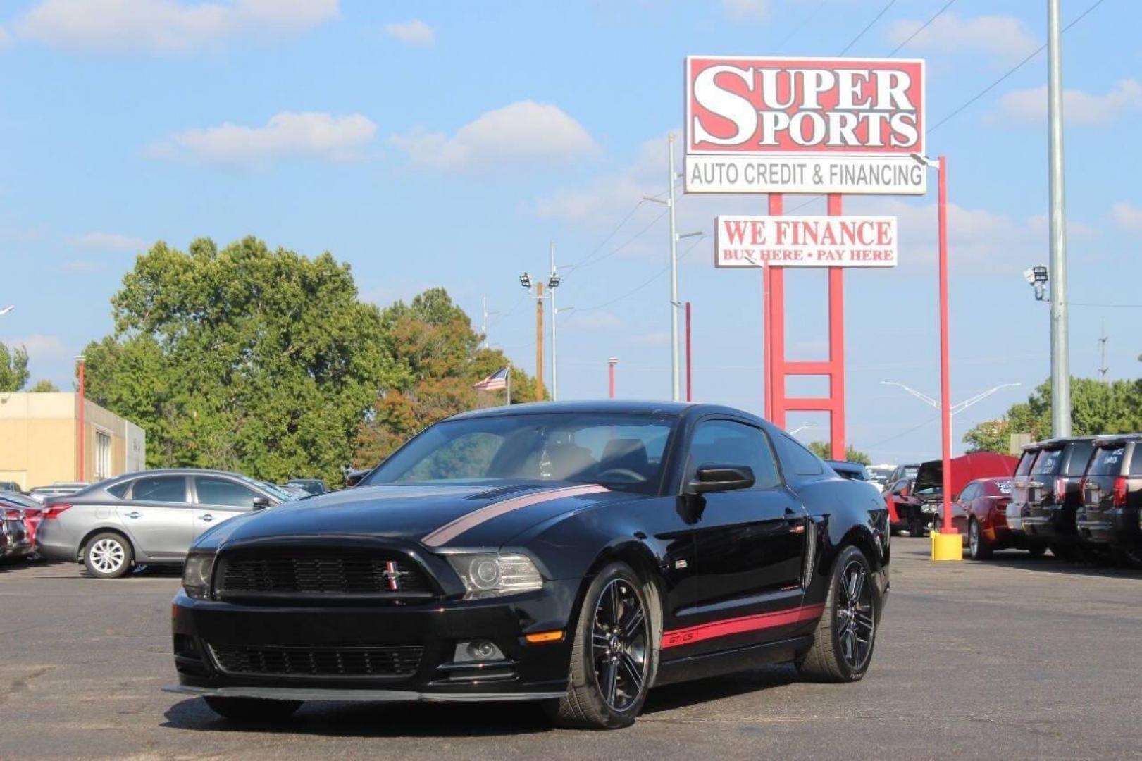 2013 Black Ford Mustang GT Coupe (1ZVBP8CF1D5) with an 5.0L V8 DOHC 32V engine, Manual 6-Speed transmission, located at 4301 NW 39th , Oklahoma City, OK, 73112, (405) 949-5600, 35.512135, -97.598671 - NO DRIVERS LICENCE NO-FULL COVERAGE INSURANCE-NO CREDIT CHECK. COME ON OVER TO SUPERSPORTS AND TAKE A LOOK AND TEST DRIVE. PLEASE GIVE US A CALL AT (405) 949-5600. NO LICENSIA DE MANEJAR- NO SEGURO DE COBERTURA TOTAL- NO VERIFICACCION DE CREDITO. POR FAVOR VENGAN A SUPERSPORTS, ECHE UN - Photo#6