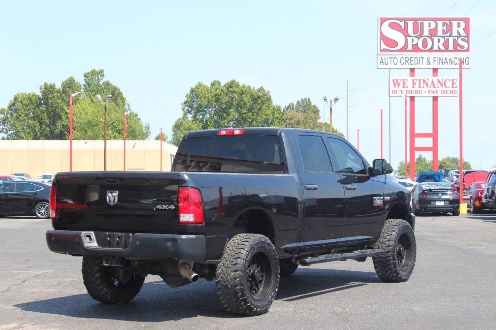 2017 Black RAM 2500 Tradesman Crew Cab SWB 4WD (3C6UR5CJ0HG) with an 6.4L V8 engine, 6A transmission, located at 4301 NW 39th , Oklahoma City, OK, 73112, (405) 949-5600, 35.512135, -97.598671 - NO DRIVERS LICENCE NO-FULL COVERAGE INSURANCE-NO CREDIT CHECK. COME ON OVER TO SUPERSPORTS AND TAKE A LOOK AND TEST DRIVE. PLEASE GIVE US A CALL AT (405) 949-5600. NO LICENSIA DE MANEJAR- NO SEGURO DE COBERTURA TOTAL- NO VERIFICACCION DE CREDITO. POR FAVOR VENGAN A SUPERSPORTS, ECHE UN - Photo#3