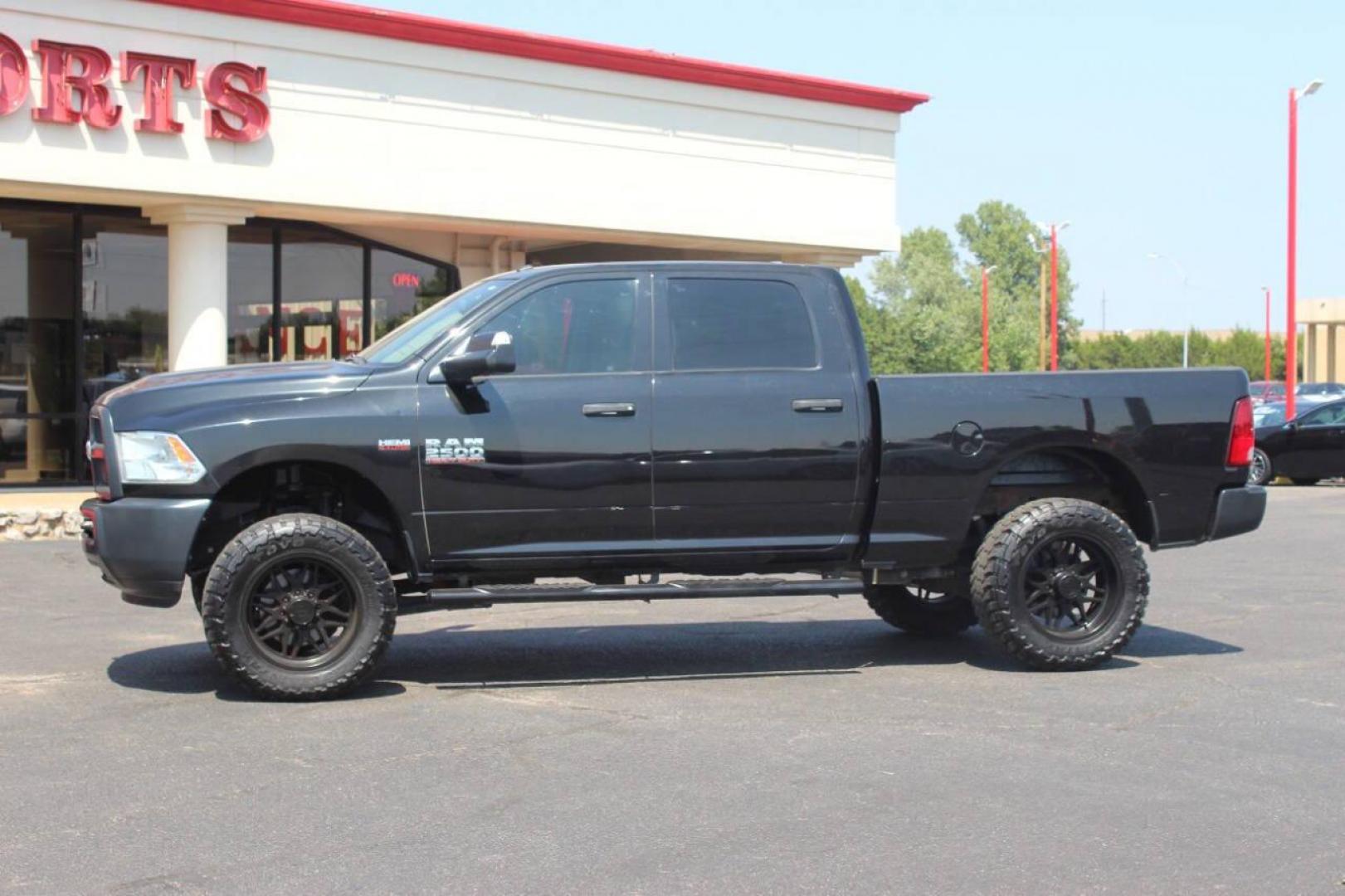 2017 Black RAM 2500 Tradesman Crew Cab SWB 4WD (3C6UR5CJ0HG) with an 6.4L V8 engine, 6A transmission, located at 4301 NW 39th , Oklahoma City, OK, 73112, (405) 949-5600, 35.512135, -97.598671 - NO DRIVERS LICENCE NO-FULL COVERAGE INSURANCE-NO CREDIT CHECK. COME ON OVER TO SUPERSPORTS AND TAKE A LOOK AND TEST DRIVE. PLEASE GIVE US A CALL AT (405) 949-5600. NO LICENSIA DE MANEJAR- NO SEGURO DE COBERTURA TOTAL- NO VERIFICACCION DE CREDITO. POR FAVOR VENGAN A SUPERSPORTS, ECHE UN - Photo#5