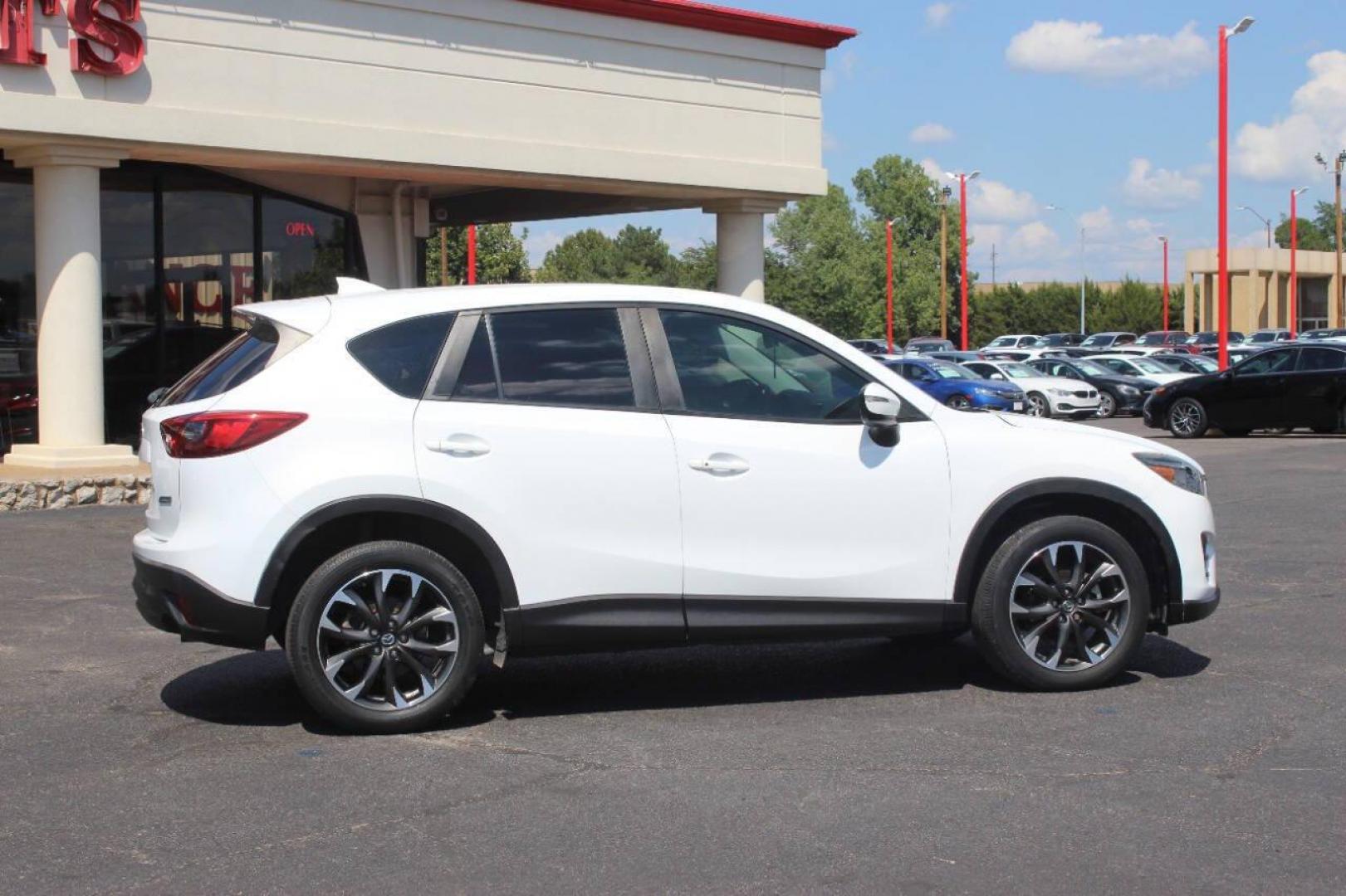 2016 White Mazda CX-5 Grand Touring (JM3KE2DY8G0) with an 2.5L L4 DOHC 16V engine, 6-Speed Automatic transmission, located at 4301 NW 39th , Oklahoma City, OK, 73112, (405) 949-5600, 35.512135, -97.598671 - NO DRIVERS LICENCE NO-FULL COVERAGE INSURANCE-NO CREDIT CHECK. COME ON OVER TO SUPERSPORTS AND TAKE A LOOK AND TEST DRIVE. PLEASE GIVE US A CALL AT (405) 949-5600. NO LICENSIA DE MANEJAR- NO SEGURO DE COBERTURA TOTAL- NO VERIFICACCION DE CREDITO. POR FAVOR VENGAN A SUPERSPORTS, ECHE UN - Photo#2