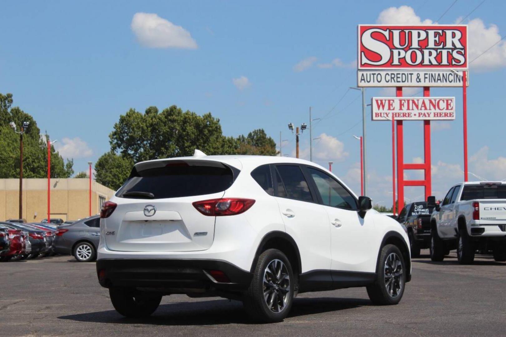 2016 White Mazda CX-5 Grand Touring (JM3KE2DY8G0) with an 2.5L L4 DOHC 16V engine, 6-Speed Automatic transmission, located at 4301 NW 39th , Oklahoma City, OK, 73112, (405) 949-5600, 35.512135, -97.598671 - NO DRIVERS LICENCE NO-FULL COVERAGE INSURANCE-NO CREDIT CHECK. COME ON OVER TO SUPERSPORTS AND TAKE A LOOK AND TEST DRIVE. PLEASE GIVE US A CALL AT (405) 949-5600. NO LICENSIA DE MANEJAR- NO SEGURO DE COBERTURA TOTAL- NO VERIFICACCION DE CREDITO. POR FAVOR VENGAN A SUPERSPORTS, ECHE UN - Photo#3