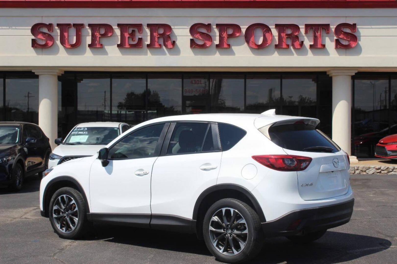 2016 White Mazda CX-5 Grand Touring (JM3KE2DY8G0) with an 2.5L L4 DOHC 16V engine, 6-Speed Automatic transmission, located at 4301 NW 39th , Oklahoma City, OK, 73112, (405) 949-5600, 35.512135, -97.598671 - NO DRIVERS LICENCE NO-FULL COVERAGE INSURANCE-NO CREDIT CHECK. COME ON OVER TO SUPERSPORTS AND TAKE A LOOK AND TEST DRIVE. PLEASE GIVE US A CALL AT (405) 949-5600. NO LICENSIA DE MANEJAR- NO SEGURO DE COBERTURA TOTAL- NO VERIFICACCION DE CREDITO. POR FAVOR VENGAN A SUPERSPORTS, ECHE UN - Photo#4