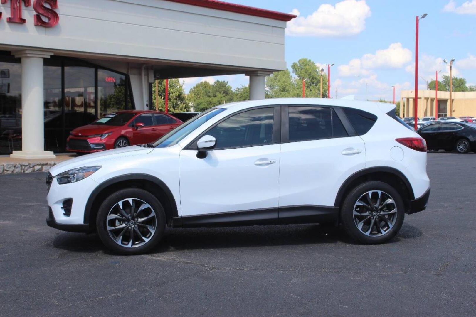 2016 White Mazda CX-5 Grand Touring (JM3KE2DY8G0) with an 2.5L L4 DOHC 16V engine, 6-Speed Automatic transmission, located at 4301 NW 39th , Oklahoma City, OK, 73112, (405) 949-5600, 35.512135, -97.598671 - NO DRIVERS LICENCE NO-FULL COVERAGE INSURANCE-NO CREDIT CHECK. COME ON OVER TO SUPERSPORTS AND TAKE A LOOK AND TEST DRIVE. PLEASE GIVE US A CALL AT (405) 949-5600. NO LICENSIA DE MANEJAR- NO SEGURO DE COBERTURA TOTAL- NO VERIFICACCION DE CREDITO. POR FAVOR VENGAN A SUPERSPORTS, ECHE UN - Photo#5