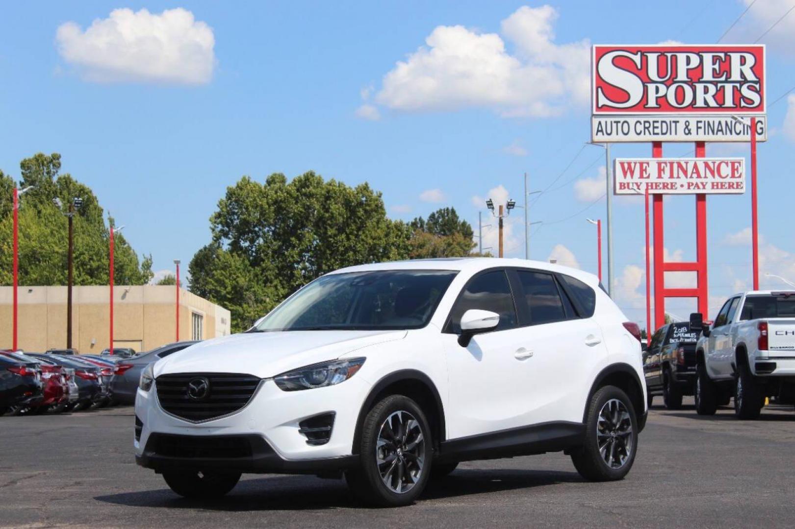 2016 White Mazda CX-5 Grand Touring (JM3KE2DY8G0) with an 2.5L L4 DOHC 16V engine, 6-Speed Automatic transmission, located at 4301 NW 39th , Oklahoma City, OK, 73112, (405) 949-5600, 35.512135, -97.598671 - NO DRIVERS LICENCE NO-FULL COVERAGE INSURANCE-NO CREDIT CHECK. COME ON OVER TO SUPERSPORTS AND TAKE A LOOK AND TEST DRIVE. PLEASE GIVE US A CALL AT (405) 949-5600. NO LICENSIA DE MANEJAR- NO SEGURO DE COBERTURA TOTAL- NO VERIFICACCION DE CREDITO. POR FAVOR VENGAN A SUPERSPORTS, ECHE UN - Photo#6