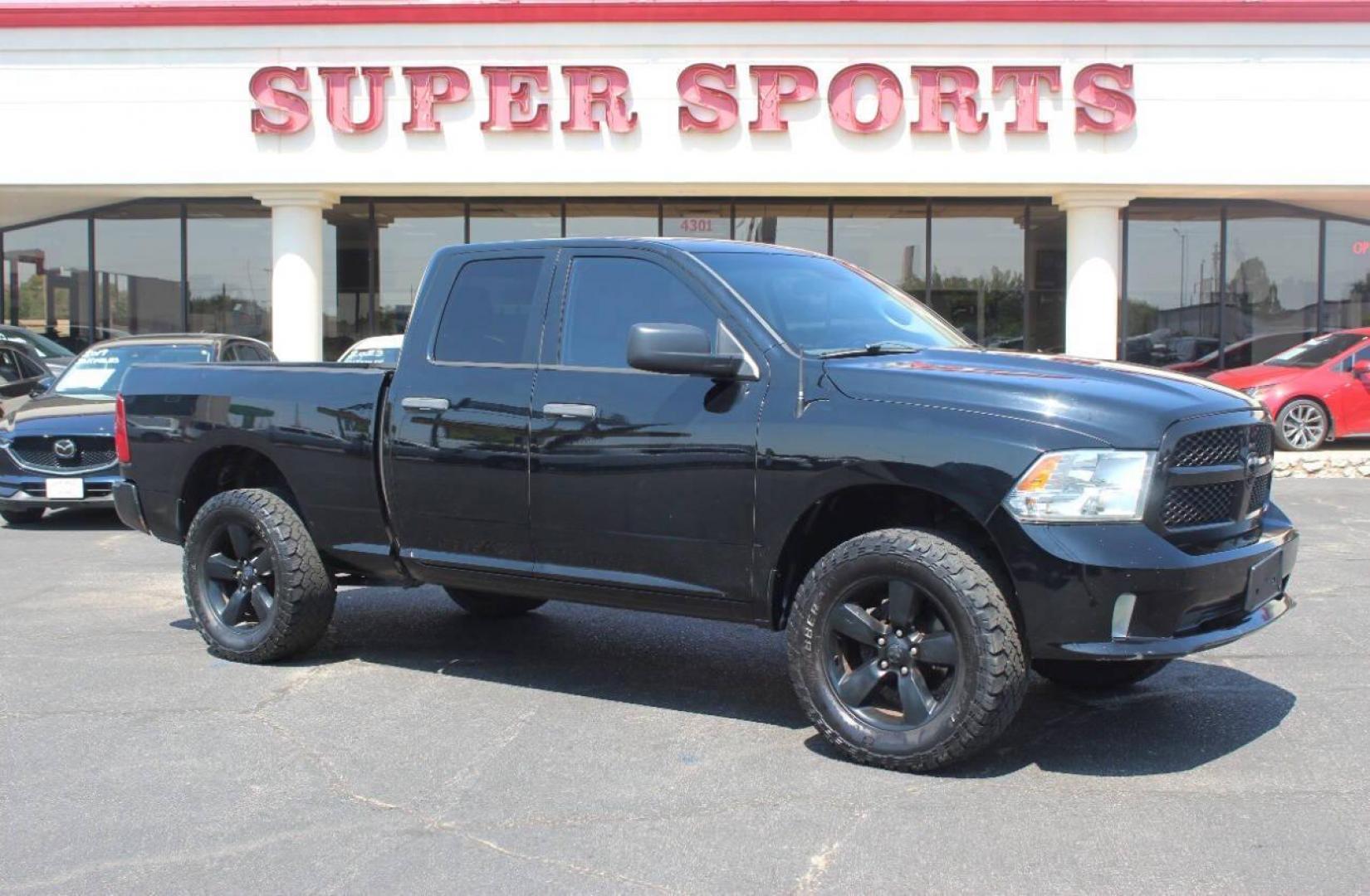 2014 Black RAM 1500 Tradesman Quad Cab 4WD (1C6RR7FT4ES) with an 5.7L V8 OHV 16V engine, 6-Speed Automatic transmission, located at 4301 NW 39th , Oklahoma City, OK, 73112, (405) 949-5600, 35.512135, -97.598671 - NO DRIVERS LICENCE NO-FULL COVERAGE INSURANCE-NO CREDIT CHECK. COME ON OVER TO SUPERSPORTS AND TAKE A LOOK AND TEST DRIVE. PLEASE GIVE US A CALL AT (405) 949-5600. NO LICENSIA DE MANEJAR- NO SEGURO DE COBERTURA TOTAL- NO VERIFICACCION DE CREDITO. POR FAVOR VENGAN A SUPERSPORTS, ECHE UN - Photo#0