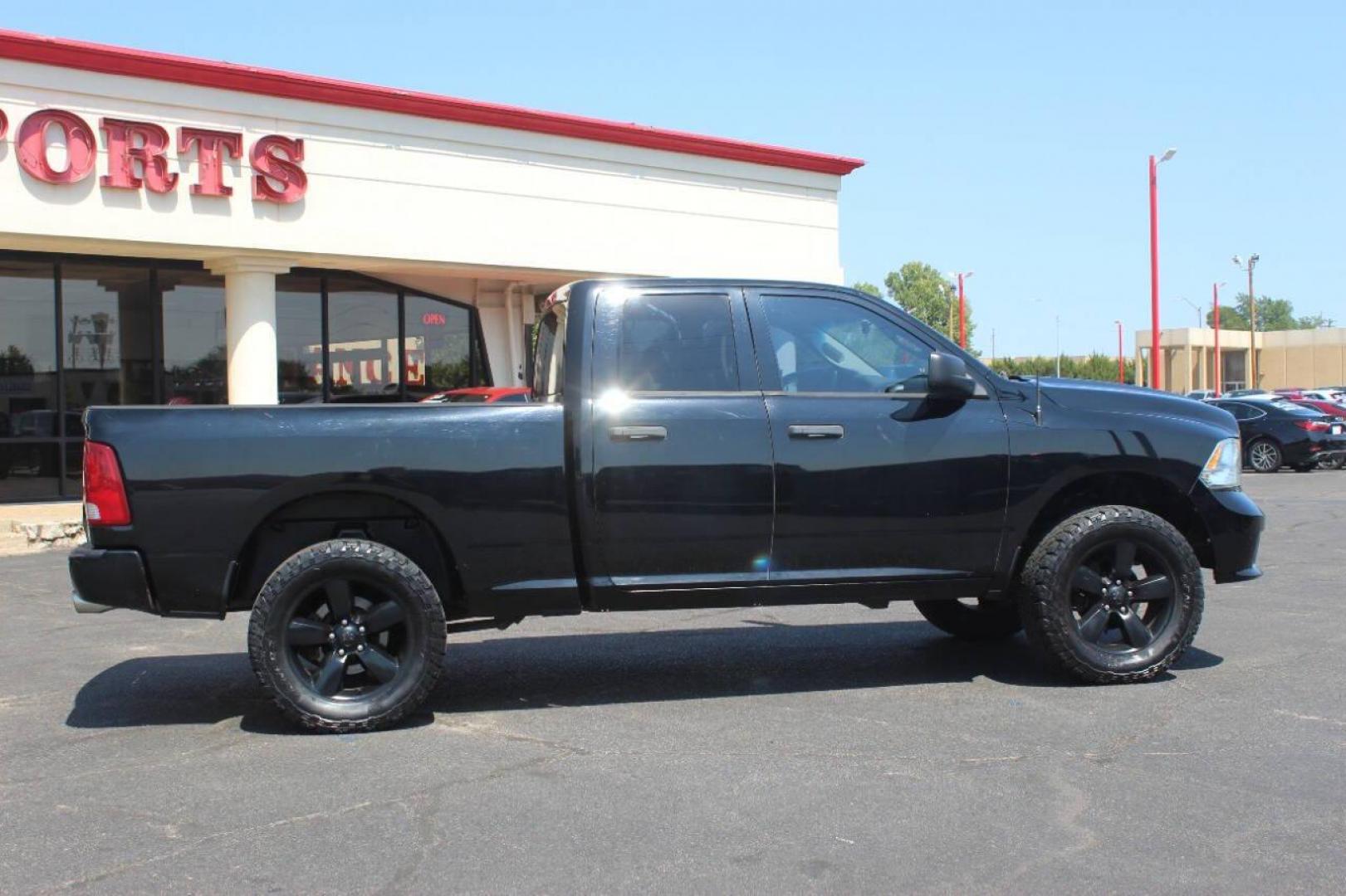 2014 Black RAM 1500 Tradesman Quad Cab 4WD (1C6RR7FT4ES) with an 5.7L V8 OHV 16V engine, 6-Speed Automatic transmission, located at 4301 NW 39th , Oklahoma City, OK, 73112, (405) 949-5600, 35.512135, -97.598671 - NO DRIVERS LICENCE NO-FULL COVERAGE INSURANCE-NO CREDIT CHECK. COME ON OVER TO SUPERSPORTS AND TAKE A LOOK AND TEST DRIVE. PLEASE GIVE US A CALL AT (405) 949-5600. NO LICENSIA DE MANEJAR- NO SEGURO DE COBERTURA TOTAL- NO VERIFICACCION DE CREDITO. POR FAVOR VENGAN A SUPERSPORTS, ECHE UN - Photo#2