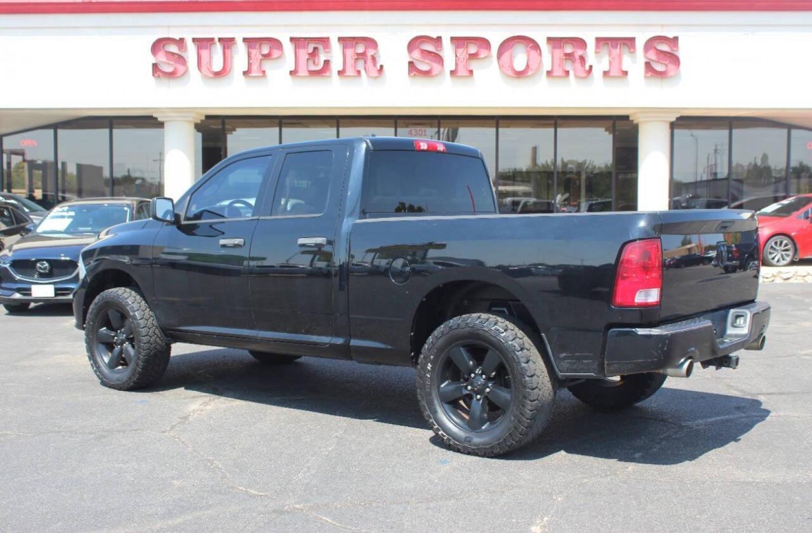 2014 Black RAM 1500 Tradesman Quad Cab 4WD (1C6RR7FT4ES) with an 5.7L V8 OHV 16V engine, 6-Speed Automatic transmission, located at 4301 NW 39th , Oklahoma City, OK, 73112, (405) 949-5600, 35.512135, -97.598671 - NO DRIVERS LICENCE NO-FULL COVERAGE INSURANCE-NO CREDIT CHECK. COME ON OVER TO SUPERSPORTS AND TAKE A LOOK AND TEST DRIVE. PLEASE GIVE US A CALL AT (405) 949-5600. NO LICENSIA DE MANEJAR- NO SEGURO DE COBERTURA TOTAL- NO VERIFICACCION DE CREDITO. POR FAVOR VENGAN A SUPERSPORTS, ECHE UN - Photo#4