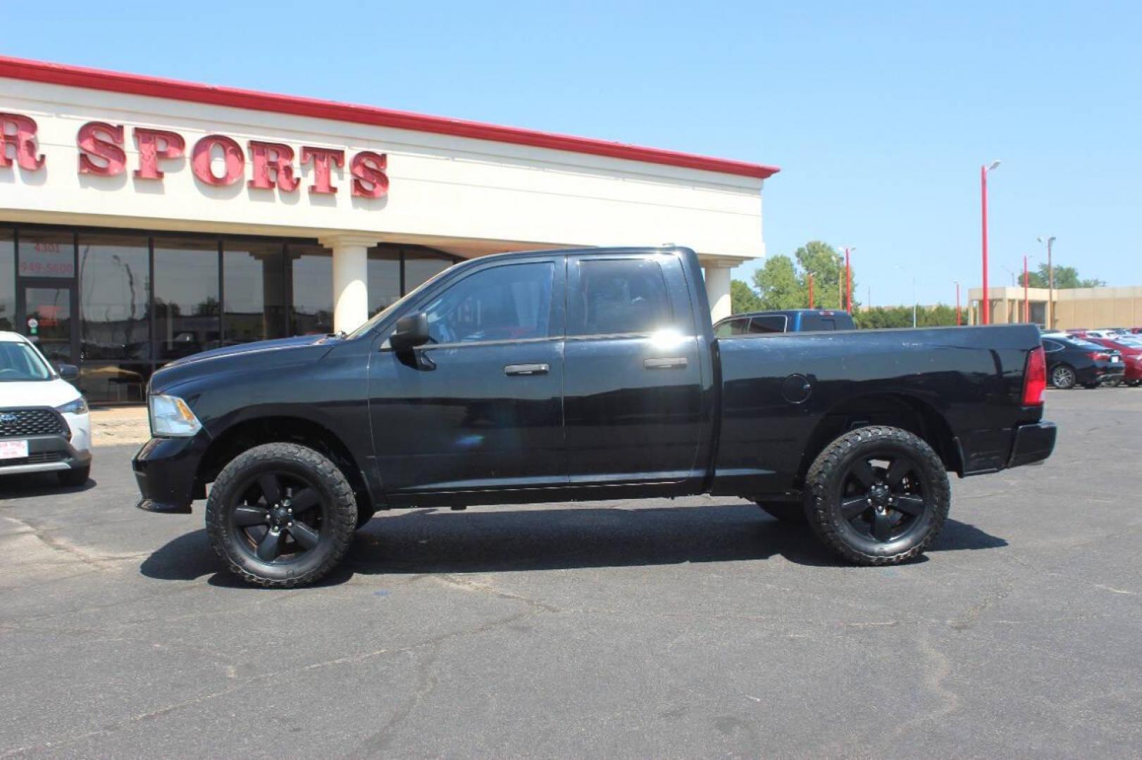 2014 Black RAM 1500 Tradesman Quad Cab 4WD (1C6RR7FT4ES) with an 5.7L V8 OHV 16V engine, 6-Speed Automatic transmission, located at 4301 NW 39th , Oklahoma City, OK, 73112, (405) 949-5600, 35.512135, -97.598671 - NO DRIVERS LICENCE NO-FULL COVERAGE INSURANCE-NO CREDIT CHECK. COME ON OVER TO SUPERSPORTS AND TAKE A LOOK AND TEST DRIVE. PLEASE GIVE US A CALL AT (405) 949-5600. NO LICENSIA DE MANEJAR- NO SEGURO DE COBERTURA TOTAL- NO VERIFICACCION DE CREDITO. POR FAVOR VENGAN A SUPERSPORTS, ECHE UN - Photo#5