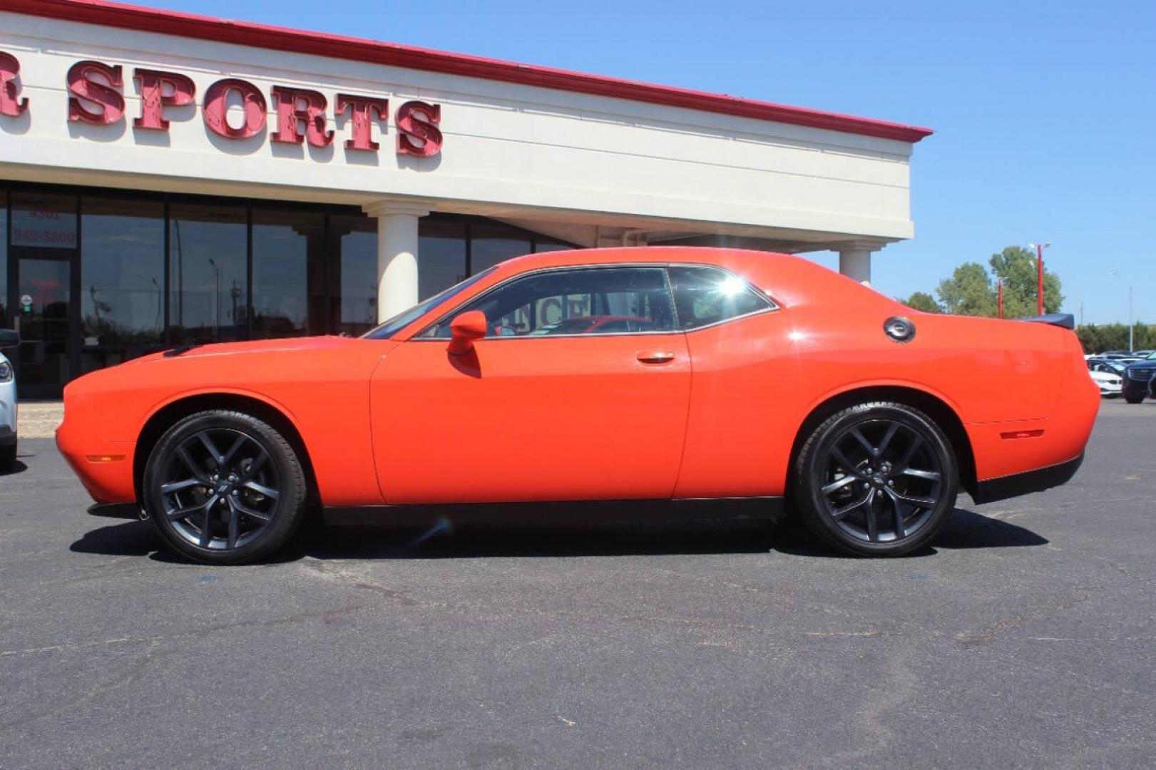 2021 Orange Dodge Challenger SXT (2C3CDZAG1MH) with an 3.6L V6 DOHC 24V engine, 8A transmission, located at 4301 NW 39th , Oklahoma City, OK, 73112, (405) 949-5600, 35.512135, -97.598671 - MUST SEE. NO DRIVERS LICENCE NO-FULL COVERAGE INSURANCE-NO CREDIT CHECK. COME ON OVER TO SUPERSPORTS AND TAKE A LOOK AND TEST DRIVE. PLEASE GIVE US A CALL AT (405) 949-5600. NO LICENSIA DE MANEJAR- NO SEGURO DE COBERTURA TOTAL- NO VERIFICACCION DE CREDITO. POR FAVOR VENGAN A SUPERS - Photo#5