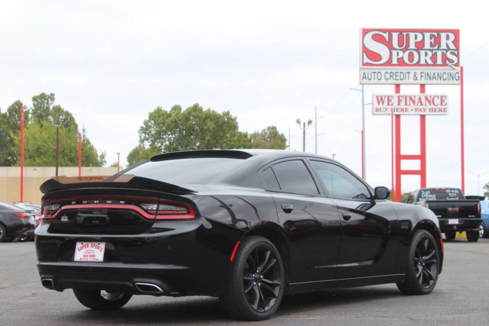 2016 Black Dodge Charger SE (2C3CDXBG0GH) with an 3.6L V6 DOHC 24V engine, 8A transmission, located at 4301 NW 39th , Oklahoma City, OK, 73112, (405) 949-5600, 35.512135, -97.598671 - Photo#3