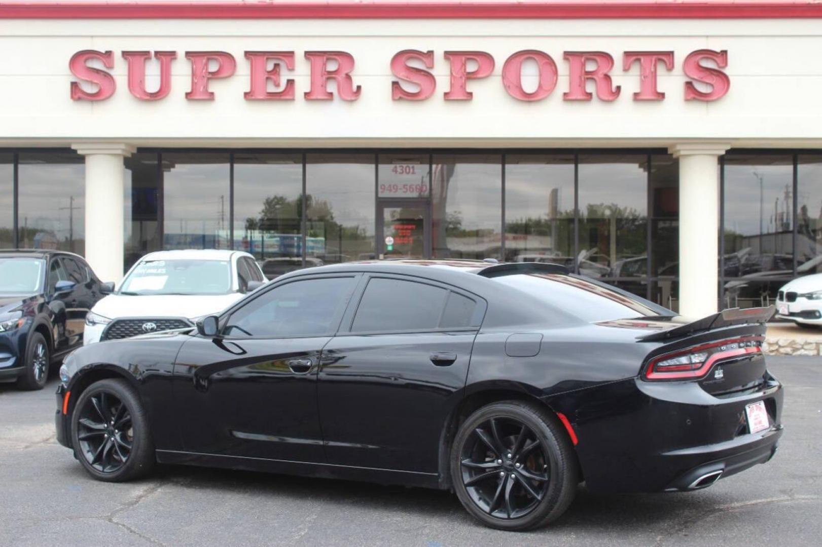 2016 Black Dodge Charger SE (2C3CDXBG0GH) with an 3.6L V6 DOHC 24V engine, 8A transmission, located at 4301 NW 39th , Oklahoma City, OK, 73112, (405) 949-5600, 35.512135, -97.598671 - Photo#4