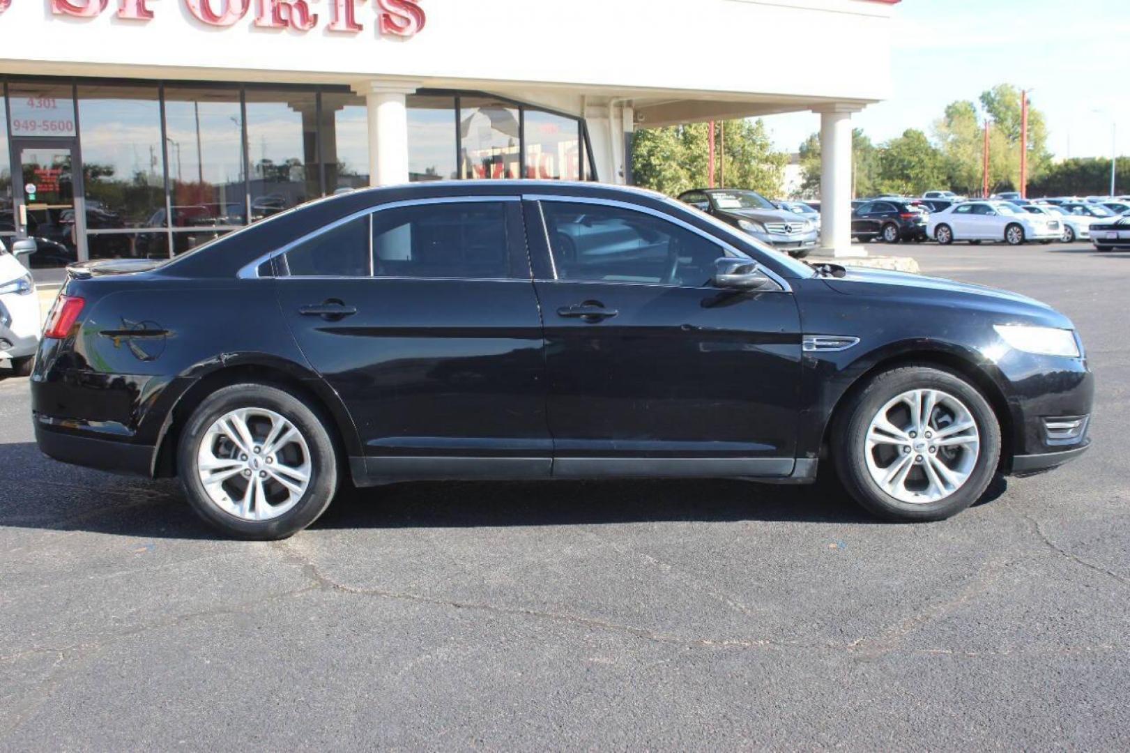 2017 Black Ford Taurus SEL FWD (1FAHP2E8XHG) with an 3.5L V6 DOHC 24V engine, 6A transmission, located at 4301 NW 39th , Oklahoma City, OK, 73112, (405) 949-5600, 35.512135, -97.598671 - NO DRIVERS LICENCE NO-FULL COVERAGE INSURANCE-NO CREDIT CHECK. COME ON OVER TO SUPERSPORTS AND TAKE A LOOK AND TEST DRIVE. PLEASE GIVE US A CALL AT (405) 949-5600. NO LICENSIA DE MANEJAR- NO SEGURO DE COBERTURA TOTAL- NO VERIFICACCION DE CREDITO. POR FAVOR VENGAN A SUPERSPORTS, ECHE UN - Photo#2