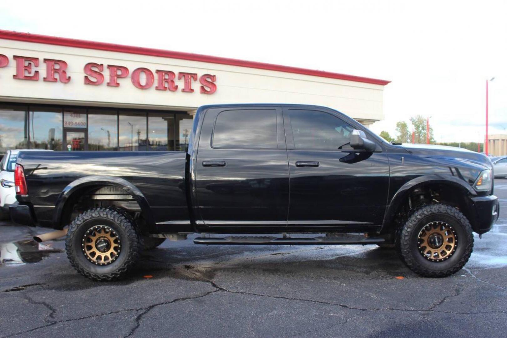 2014 Black RAM 2500 Laramie Crew Cab SWB 4WD (3C6UR5FJ2EG) with an 6.7L L6 engine, 6-Speed Automatic transmission, located at 4301 NW 39th , Oklahoma City, OK, 73112, (405) 949-5600, 35.512135, -97.598671 - NO DRIVERS LICENCE NO-FULL COVERAGE INSURANCE-NO CREDIT CHECK. COME ON OVER TO SUPERSPORTS AND TAKE A LOOK AND TEST DRIVE. PLEASE GIVE US A CALL AT (405) 949-5600. NO LICENSIA DE MANEJAR- NO SEGURO DE COBERTURA TOTAL- NO VERIFICACCION DE CREDITO. POR FAVOR VENGAN A SUPERSPORTS, ECHE UN - Photo#1