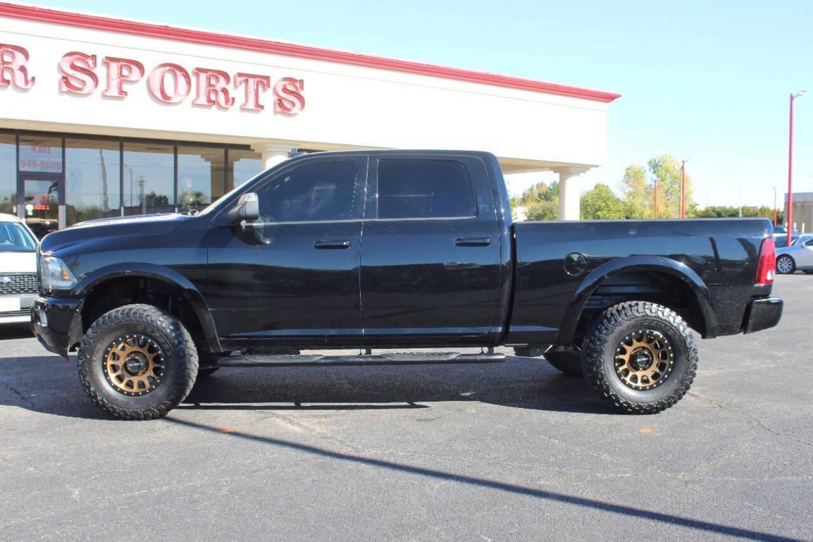 2014 Black RAM 2500 Laramie Crew Cab SWB 4WD (3C6UR5FJ2EG) with an 6.7L L6 engine, 6-Speed Automatic transmission, located at 4301 NW 39th , Oklahoma City, OK, 73112, (405) 949-5600, 35.512135, -97.598671 - NO DRIVERS LICENCE NO-FULL COVERAGE INSURANCE-NO CREDIT CHECK. COME ON OVER TO SUPERSPORTS AND TAKE A LOOK AND TEST DRIVE. PLEASE GIVE US A CALL AT (405) 949-5600. NO LICENSIA DE MANEJAR- NO SEGURO DE COBERTURA TOTAL- NO VERIFICACCION DE CREDITO. POR FAVOR VENGAN A SUPERSPORTS, ECHE UN - Photo#4