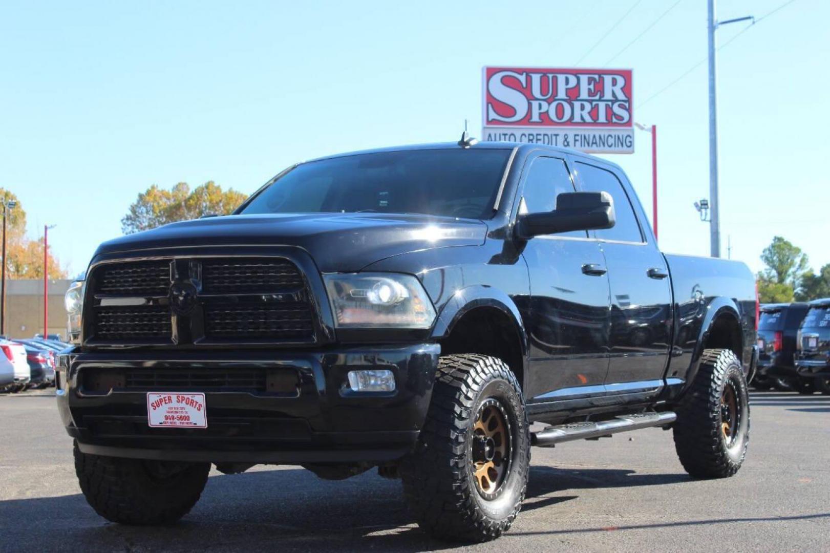 2014 Black RAM 2500 Laramie Crew Cab SWB 4WD (3C6UR5FJ2EG) with an 6.7L L6 engine, 6-Speed Automatic transmission, located at 4301 NW 39th , Oklahoma City, OK, 73112, (405) 949-5600, 35.512135, -97.598671 - NO DRIVERS LICENCE NO-FULL COVERAGE INSURANCE-NO CREDIT CHECK. COME ON OVER TO SUPERSPORTS AND TAKE A LOOK AND TEST DRIVE. PLEASE GIVE US A CALL AT (405) 949-5600. NO LICENSIA DE MANEJAR- NO SEGURO DE COBERTURA TOTAL- NO VERIFICACCION DE CREDITO. POR FAVOR VENGAN A SUPERSPORTS, ECHE UN - Photo#5