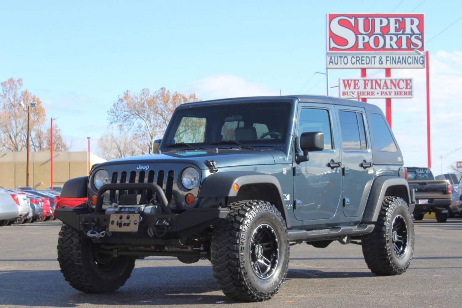 2008 Blue Jeep Wrangler Unlimited X 4WD (1J4GA39138L) with an 3.8L V6 OHV 12V engine, Automatic 4-Speed transmission, located at 4301 NW 39th , Oklahoma City, OK, 73112, (405) 949-5600, 35.512135, -97.598671 - NO DRIVERS LICENCE NO-FULL COVERAGE INSURANCE-NO CREDIT CHECK. COME ON OVER TO SUPERSPORTS AND TAKE A LOOK AND TEST DRIVE. PLEASE GIVE US A CALL AT (405) 949-5600. NO LICENSIA DE MANEJAR- NO SEGURO DE COBERTURA TOTAL- NO VERIFICACCION DE CREDITO. POR FAVOR VENGAN A SUPERSPORTS, ECHE UN - Photo#7