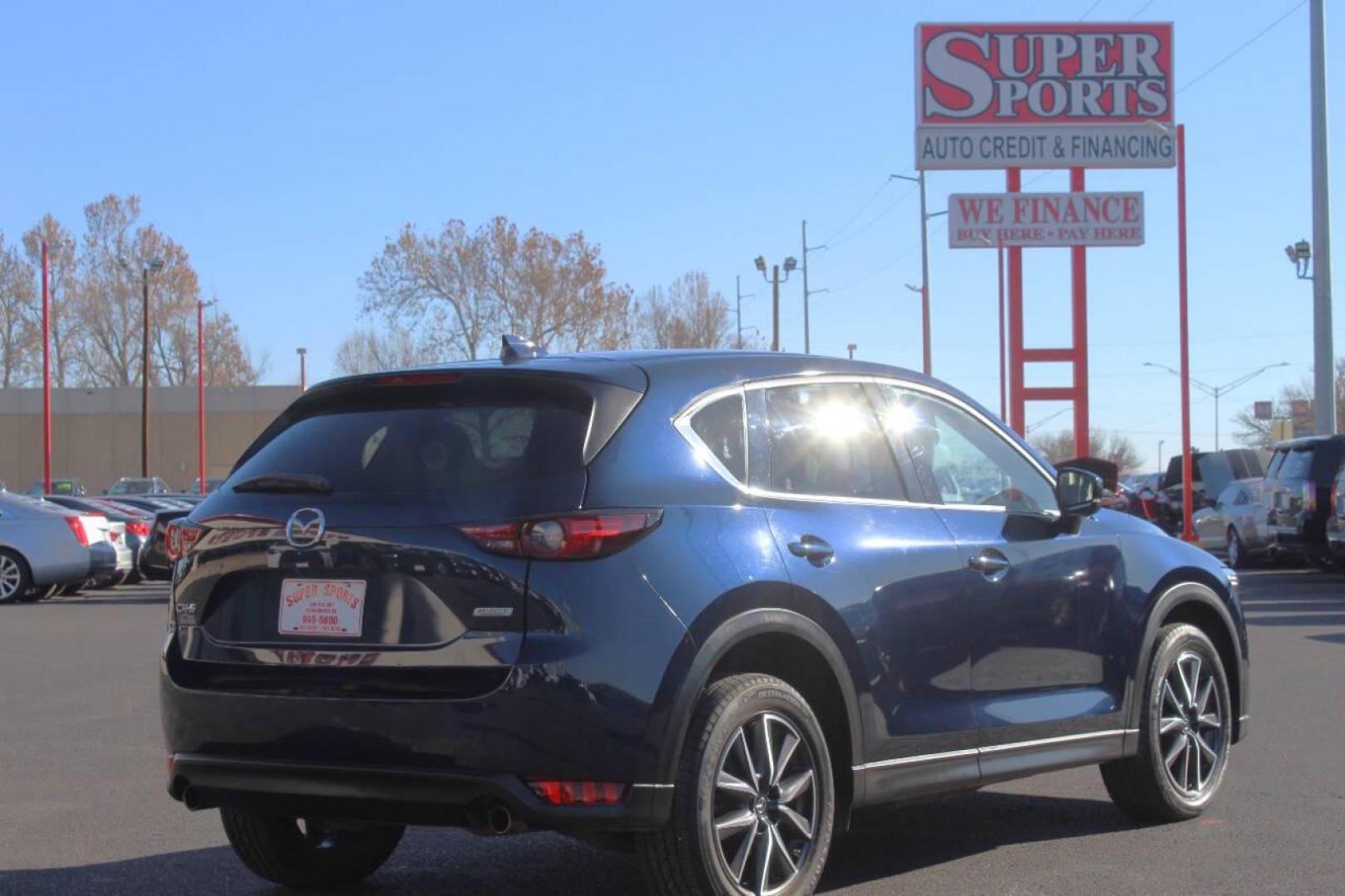 2017 Blue Mazda CX-5 Grand Touring (JM3KFADLXH0) with an 2.5L L4 DOHC 16V engine, 6A transmission, located at 4301 NW 39th , Oklahoma City, OK, 73112, (405) 949-5600, 35.512135, -97.598671 - NO DRIVERS LICENCE NO-FULL COVERAGE INSURANCE-NO CREDIT CHECK. COME ON OVER TO SUPERSPORTS AND TAKE A LOOK AND TEST DRIVE. PLEASE GIVE US A CALL AT (405) 949-5600. NO LICENSIA DE MANEJAR- NO SEGURO DE COBERTURA TOTAL- NO VERIFICACCION DE CREDITO. POR FAVOR VENGAN A SUPERSPORTS, ECHE U - Photo#3