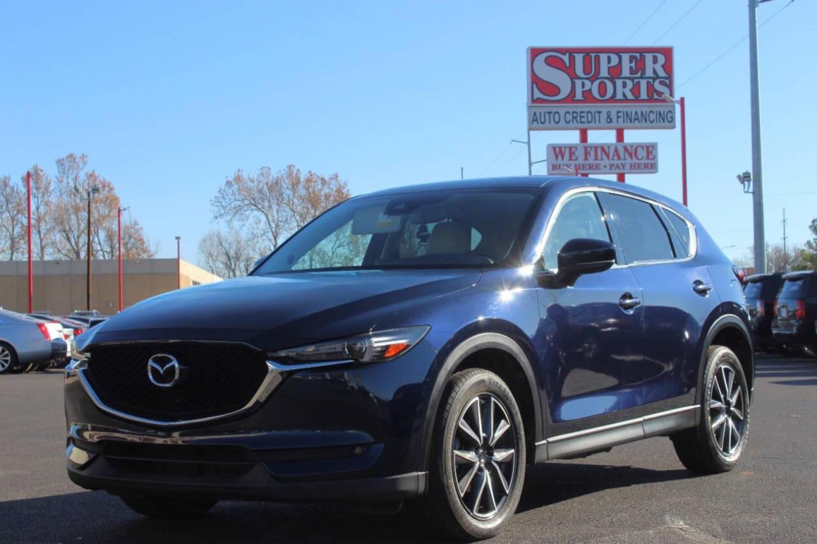 2017 Blue Mazda CX-5 Grand Touring (JM3KFADLXH0) with an 2.5L L4 DOHC 16V engine, 6A transmission, located at 4301 NW 39th , Oklahoma City, OK, 73112, (405) 949-5600, 35.512135, -97.598671 - NO DRIVERS LICENCE NO-FULL COVERAGE INSURANCE-NO CREDIT CHECK. COME ON OVER TO SUPERSPORTS AND TAKE A LOOK AND TEST DRIVE. PLEASE GIVE US A CALL AT (405) 949-5600. NO LICENSIA DE MANEJAR- NO SEGURO DE COBERTURA TOTAL- NO VERIFICACCION DE CREDITO. POR FAVOR VENGAN A SUPERSPORTS, ECHE U - Photo#6