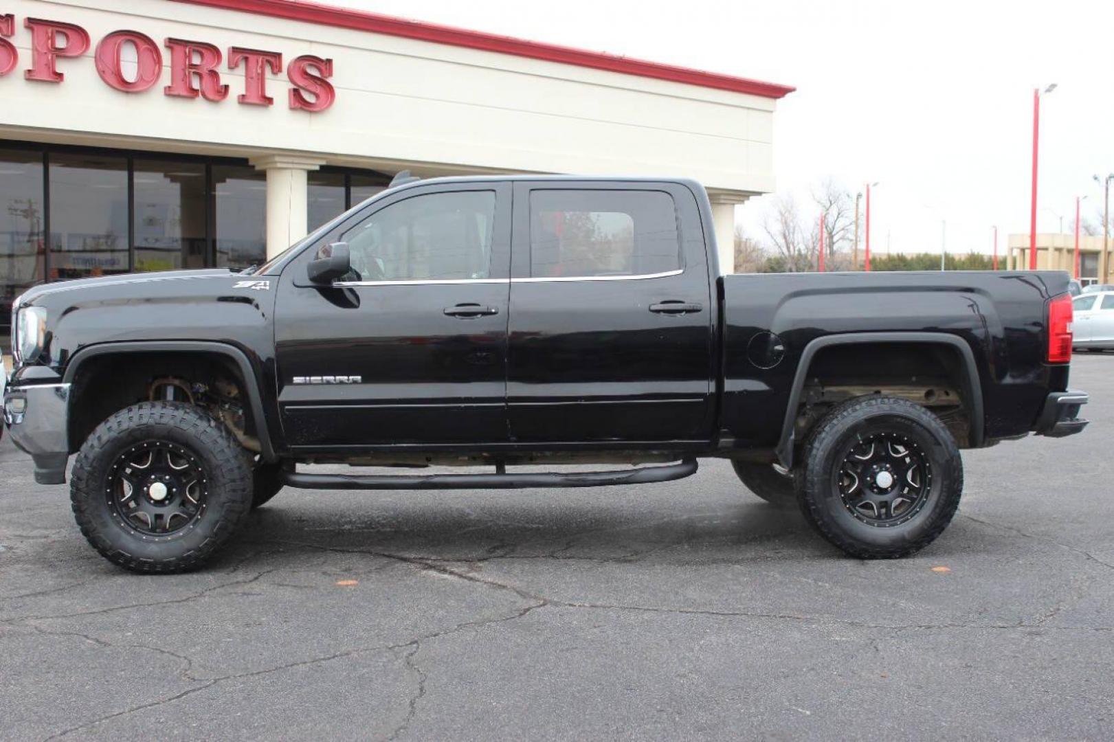 2016 Black GMC Sierra 1500 SLE Crew Cab Long Box 4WD (3GTU2MEC1GG) with an 5.3L V8 OHV 16V engine, 6A transmission, located at 4301 NW 39th , Oklahoma City, OK, 73112, (405) 949-5600, 35.512135, -97.598671 - NO DRIVERS LICENCE NO-FULL COVERAGE INSURANCE-NO CREDIT CHECK. COME ON OVER TO SUPERSPORTS AND TAKE A LOOK AND TEST DRIVE. PLEASE GIVE US A CALL AT (405) 949-5600. NO LICENSIA DE MANEJAR- NO SEGURO DE COBERTURA TOTAL- NO VERIFICACCION DE CREDITO. POR FAVOR VENGAN A SUPERSPORTS, ECHE U - Photo#5