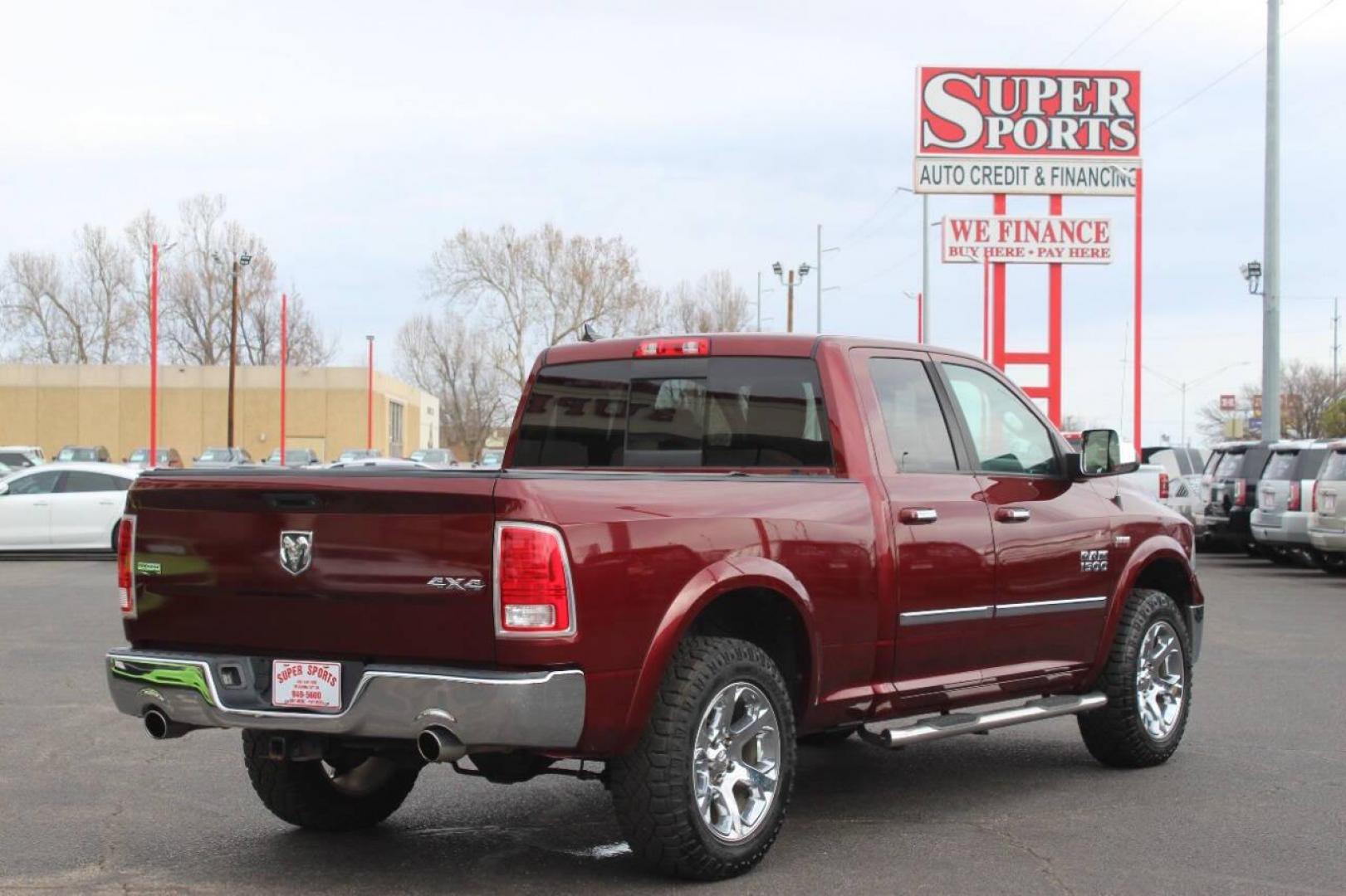 2016 Burgundy RAM 1500 Laramie Quad Cab 4WD (1C6RR7JT8GS) with an 5.7L V8 OHV 16V engine, 6A transmission, located at 4301 NW 39th , Oklahoma City, OK, 73112, (405) 949-5600, 35.512135, -97.598671 - NO DRIVERS LICENCE NO-FULL COVERAGE INSURANCE-NO CREDIT CHECK. COME ON OVER TO SUPERSPORTS AND TAKE A LOOK AND TEST DRIVE. PLEASE GIVE US A CALL AT (405) 949-5600. NO LICENSIA DE MANEJAR- NO SEGURO DE COBERTURA TOTAL- NO VERIFICACCION DE CREDITO. POR FAVOR VENGAN A SUPERSPORTS, ECHE UN - Photo#3