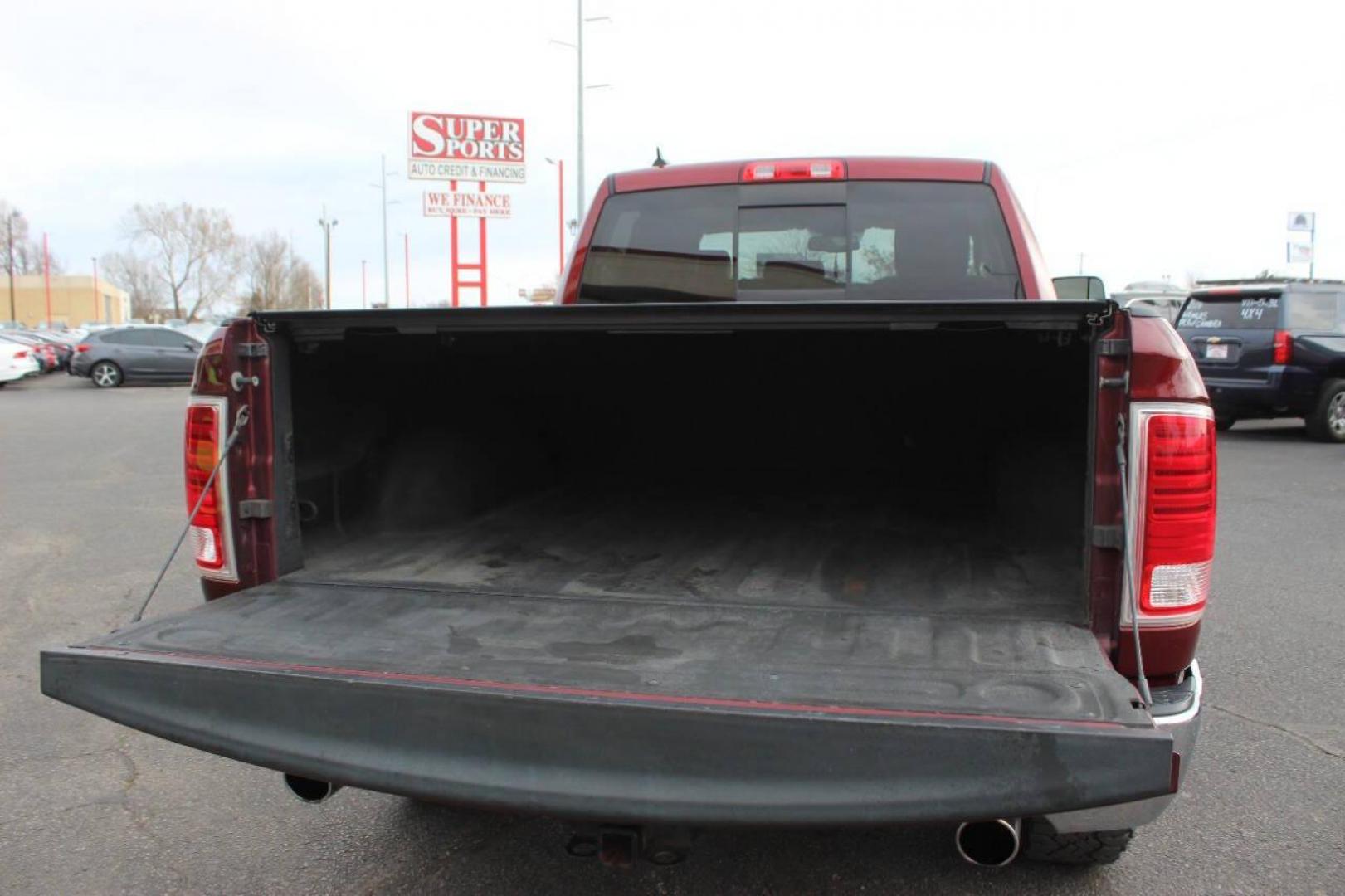 2016 Burgundy RAM 1500 Laramie Quad Cab 4WD (1C6RR7JT8GS) with an 5.7L V8 OHV 16V engine, 6A transmission, located at 4301 NW 39th , Oklahoma City, OK, 73112, (405) 949-5600, 35.512135, -97.598671 - NO DRIVERS LICENCE NO-FULL COVERAGE INSURANCE-NO CREDIT CHECK. COME ON OVER TO SUPERSPORTS AND TAKE A LOOK AND TEST DRIVE. PLEASE GIVE US A CALL AT (405) 949-5600. NO LICENSIA DE MANEJAR- NO SEGURO DE COBERTURA TOTAL- NO VERIFICACCION DE CREDITO. POR FAVOR VENGAN A SUPERSPORTS, ECHE UN - Photo#5