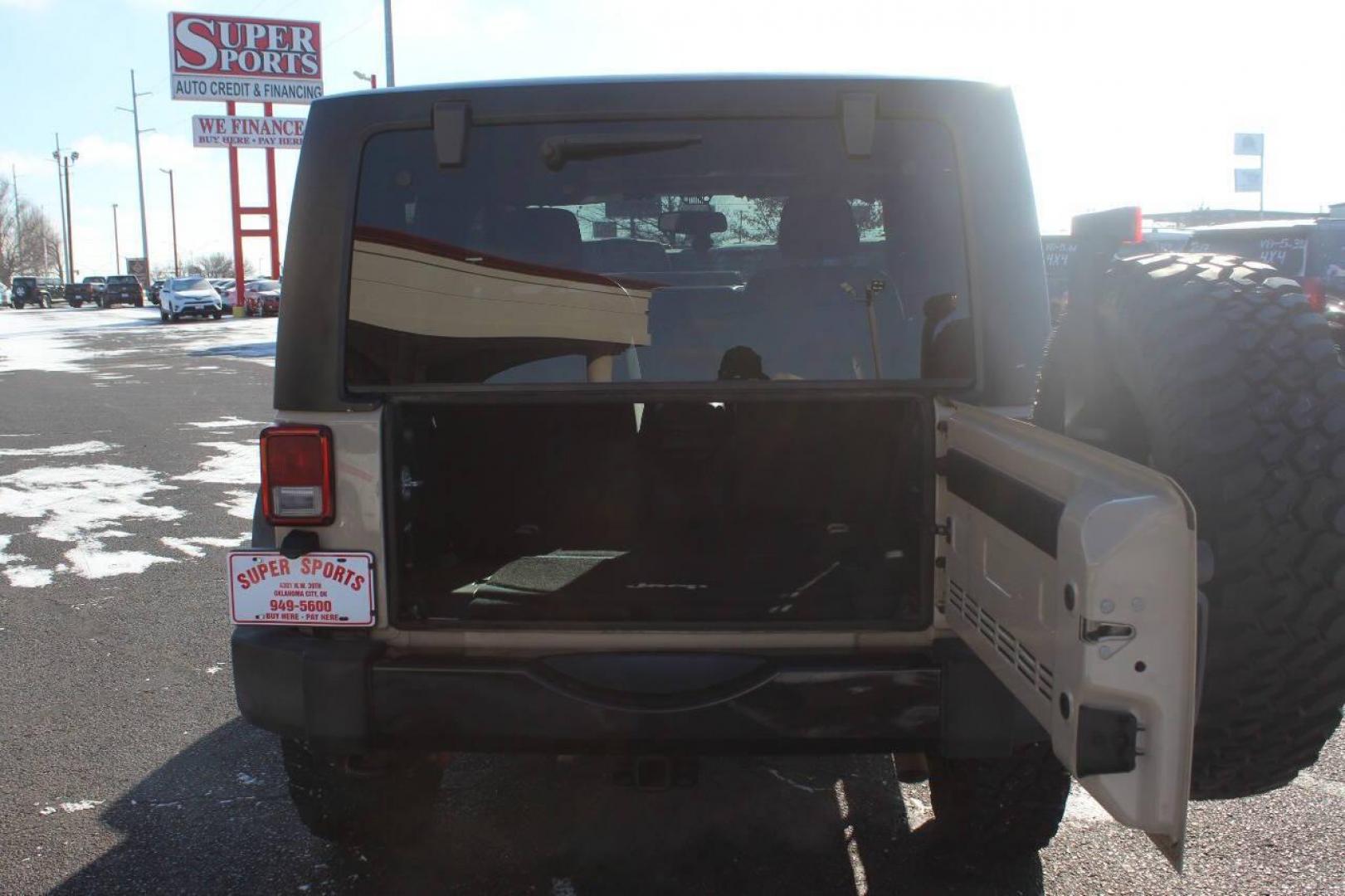 2016 Tan Jeep Wrangler Sport 4WD (1C4AJWAG7GL) with an 3.6L V6 DOHC 24V FFV engine, Automatic 5-Speed transmission, located at 4301 NW 39th , Oklahoma City, OK, 73112, (405) 949-5600, 35.512135, -97.598671 - NO DRIVERS LICENCE NO-FULL COVERAGE INSURANCE-NO CREDIT CHECK. COME ON OVER TO SUPERSPORTS AND TAKE A LOOK AND TEST DRIVE. PLEASE GIVE US A CALL AT (405) 949-5600. NO LICENSIA DE MANEJAR- NO SEGURO DE COBERTURA TOTAL- NO VERIFICACCION DE CREDITO. POR FAVOR VENGAN A SUPERSPORTS, ECHE U - Photo#10