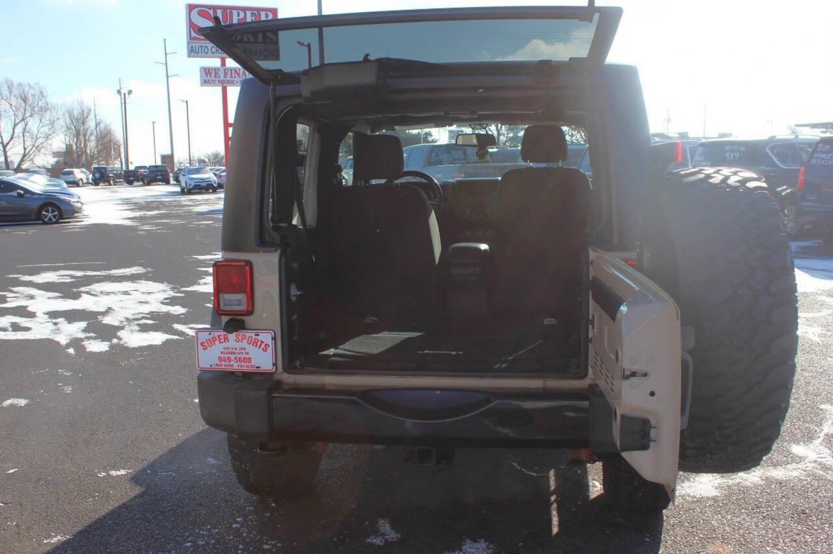 2016 Tan Jeep Wrangler Sport 4WD (1C4AJWAG7GL) with an 3.6L V6 DOHC 24V FFV engine, Automatic 5-Speed transmission, located at 4301 NW 39th , Oklahoma City, OK, 73112, (405) 949-5600, 35.512135, -97.598671 - NO DRIVERS LICENCE NO-FULL COVERAGE INSURANCE-NO CREDIT CHECK. COME ON OVER TO SUPERSPORTS AND TAKE A LOOK AND TEST DRIVE. PLEASE GIVE US A CALL AT (405) 949-5600. NO LICENSIA DE MANEJAR- NO SEGURO DE COBERTURA TOTAL- NO VERIFICACCION DE CREDITO. POR FAVOR VENGAN A SUPERSPORTS, ECHE U - Photo#11