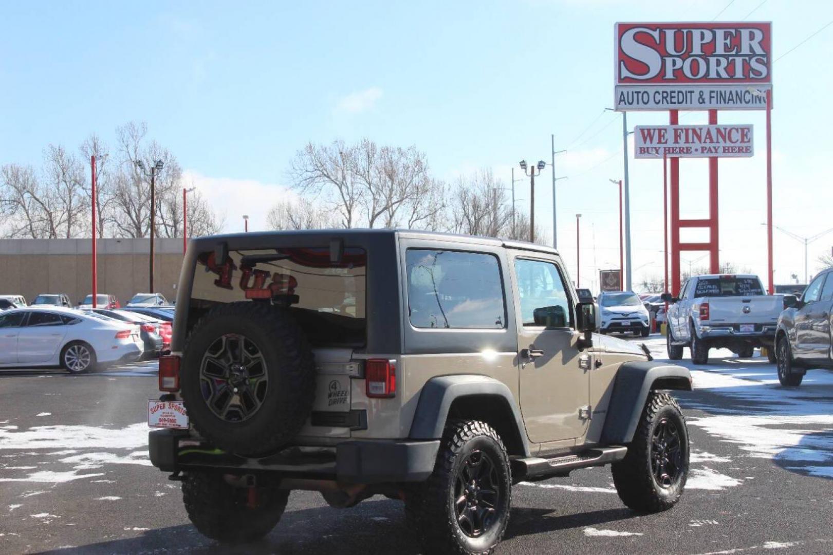 2016 Tan Jeep Wrangler Sport 4WD (1C4AJWAG7GL) with an 3.6L V6 DOHC 24V FFV engine, Automatic 5-Speed transmission, located at 4301 NW 39th , Oklahoma City, OK, 73112, (405) 949-5600, 35.512135, -97.598671 - NO DRIVERS LICENCE NO-FULL COVERAGE INSURANCE-NO CREDIT CHECK. COME ON OVER TO SUPERSPORTS AND TAKE A LOOK AND TEST DRIVE. PLEASE GIVE US A CALL AT (405) 949-5600. NO LICENSIA DE MANEJAR- NO SEGURO DE COBERTURA TOTAL- NO VERIFICACCION DE CREDITO. POR FAVOR VENGAN A SUPERSPORTS, ECHE U - Photo#3