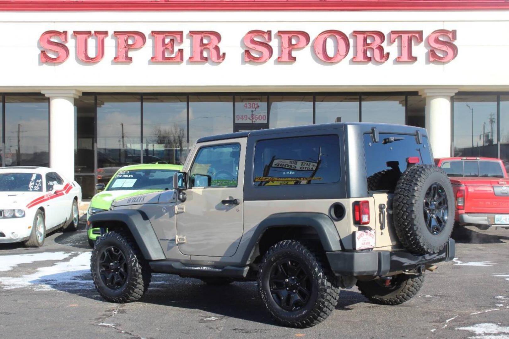 2016 Tan Jeep Wrangler Sport 4WD (1C4AJWAG7GL) with an 3.6L V6 DOHC 24V FFV engine, Automatic 5-Speed transmission, located at 4301 NW 39th , Oklahoma City, OK, 73112, (405) 949-5600, 35.512135, -97.598671 - NO DRIVERS LICENCE NO-FULL COVERAGE INSURANCE-NO CREDIT CHECK. COME ON OVER TO SUPERSPORTS AND TAKE A LOOK AND TEST DRIVE. PLEASE GIVE US A CALL AT (405) 949-5600. NO LICENSIA DE MANEJAR- NO SEGURO DE COBERTURA TOTAL- NO VERIFICACCION DE CREDITO. POR FAVOR VENGAN A SUPERSPORTS, ECHE U - Photo#4