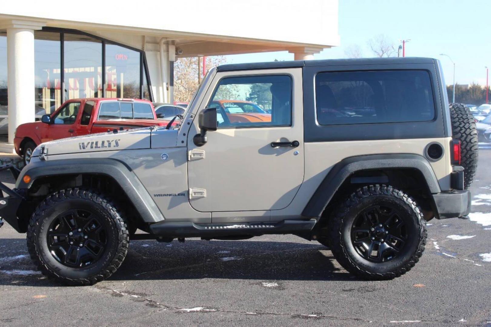 2016 Tan Jeep Wrangler Sport 4WD (1C4AJWAG7GL) with an 3.6L V6 DOHC 24V FFV engine, Automatic 5-Speed transmission, located at 4301 NW 39th , Oklahoma City, OK, 73112, (405) 949-5600, 35.512135, -97.598671 - NO DRIVERS LICENCE NO-FULL COVERAGE INSURANCE-NO CREDIT CHECK. COME ON OVER TO SUPERSPORTS AND TAKE A LOOK AND TEST DRIVE. PLEASE GIVE US A CALL AT (405) 949-5600. NO LICENSIA DE MANEJAR- NO SEGURO DE COBERTURA TOTAL- NO VERIFICACCION DE CREDITO. POR FAVOR VENGAN A SUPERSPORTS, ECHE U - Photo#5