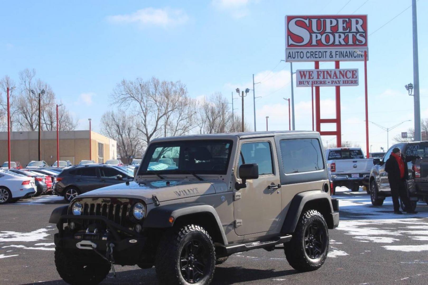 2016 Tan Jeep Wrangler Sport 4WD (1C4AJWAG7GL) with an 3.6L V6 DOHC 24V FFV engine, Automatic 5-Speed transmission, located at 4301 NW 39th , Oklahoma City, OK, 73112, (405) 949-5600, 35.512135, -97.598671 - NO DRIVERS LICENCE NO-FULL COVERAGE INSURANCE-NO CREDIT CHECK. COME ON OVER TO SUPERSPORTS AND TAKE A LOOK AND TEST DRIVE. PLEASE GIVE US A CALL AT (405) 949-5600. NO LICENSIA DE MANEJAR- NO SEGURO DE COBERTURA TOTAL- NO VERIFICACCION DE CREDITO. POR FAVOR VENGAN A SUPERSPORTS, ECHE U - Photo#6